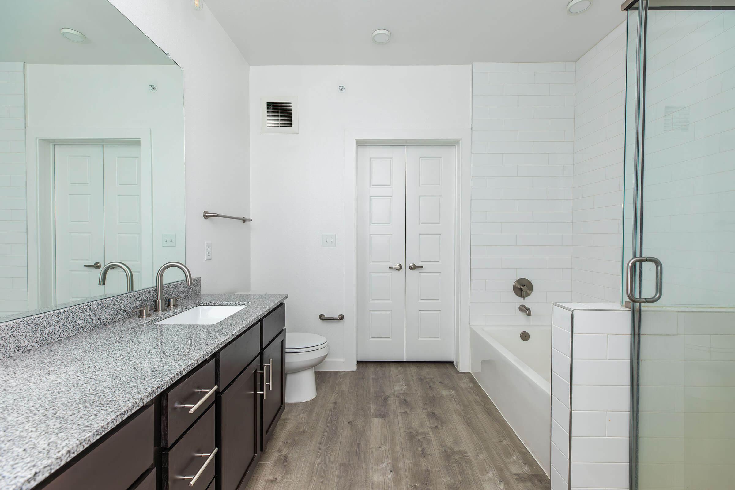 a kitchen with a sink and a mirror