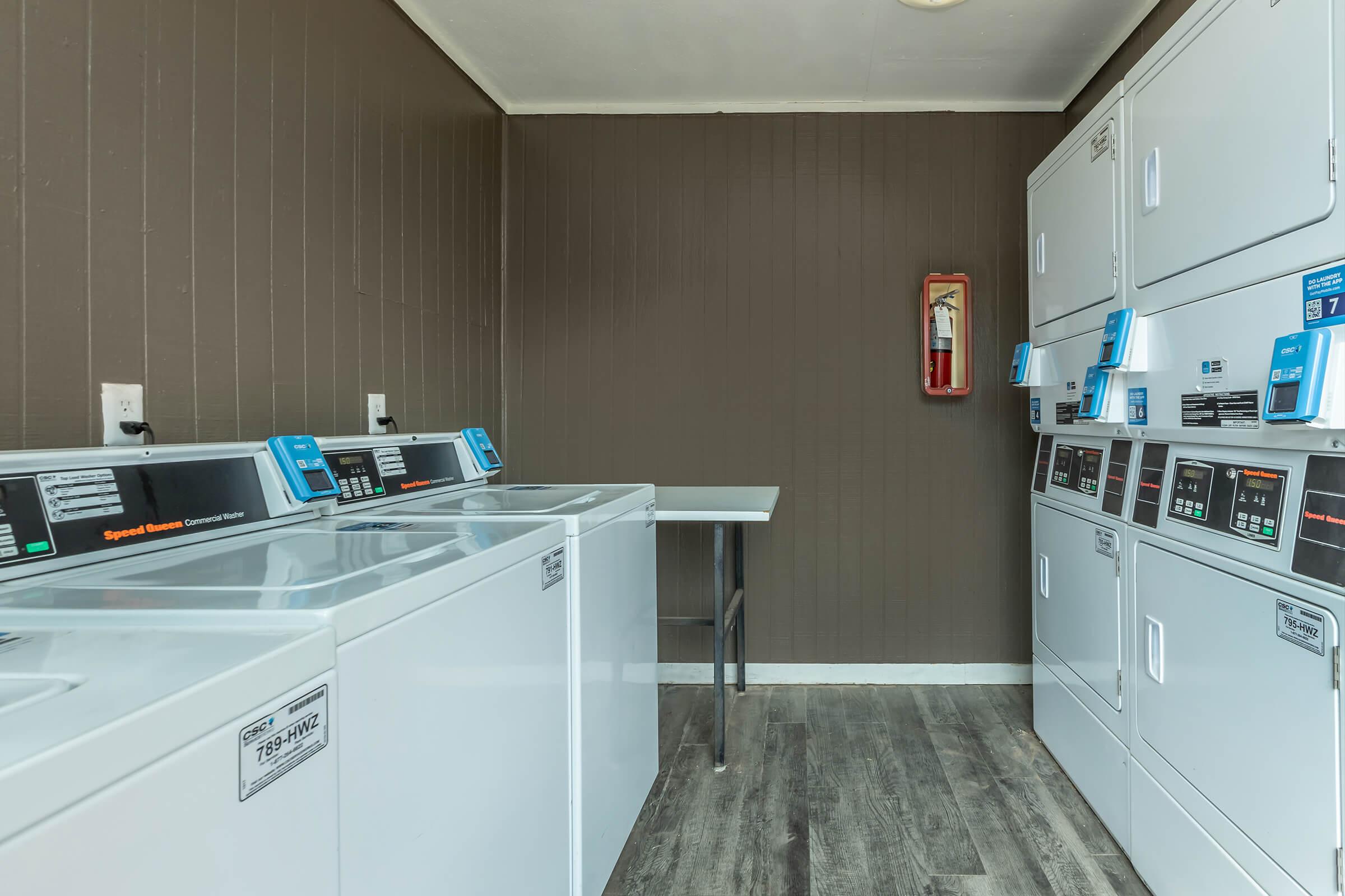 a kitchen with a sink and a refrigerator