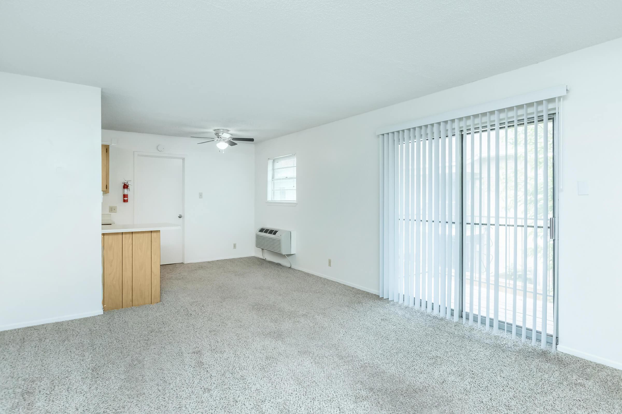 a bedroom with a building in the background