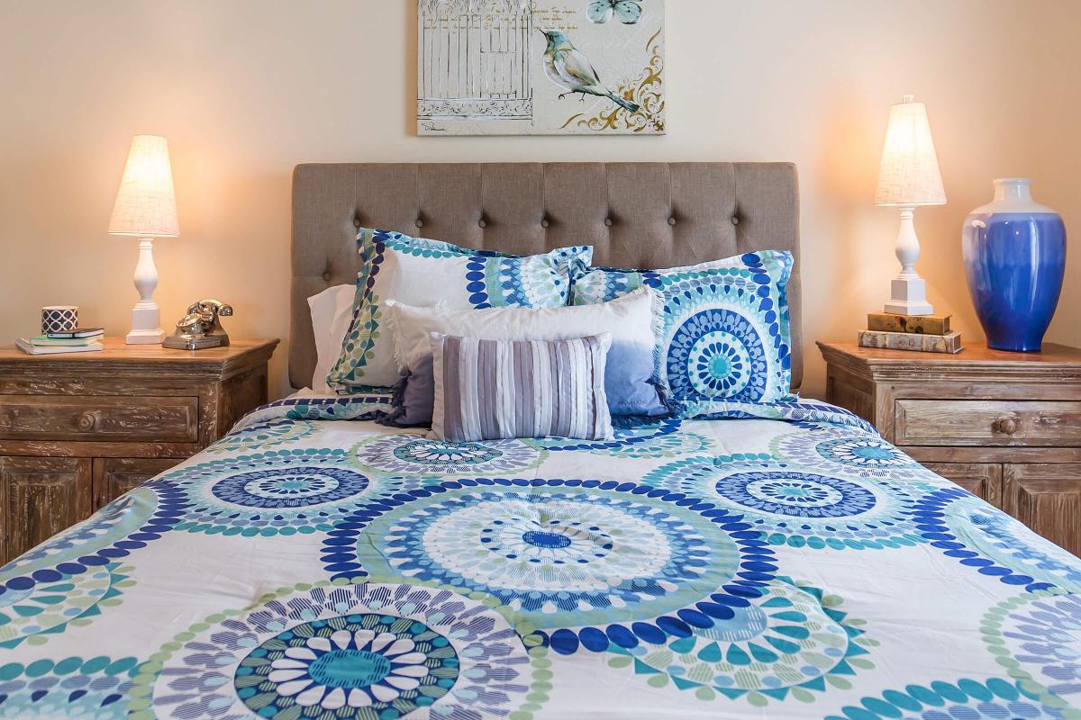 a bedroom with a bed and a table