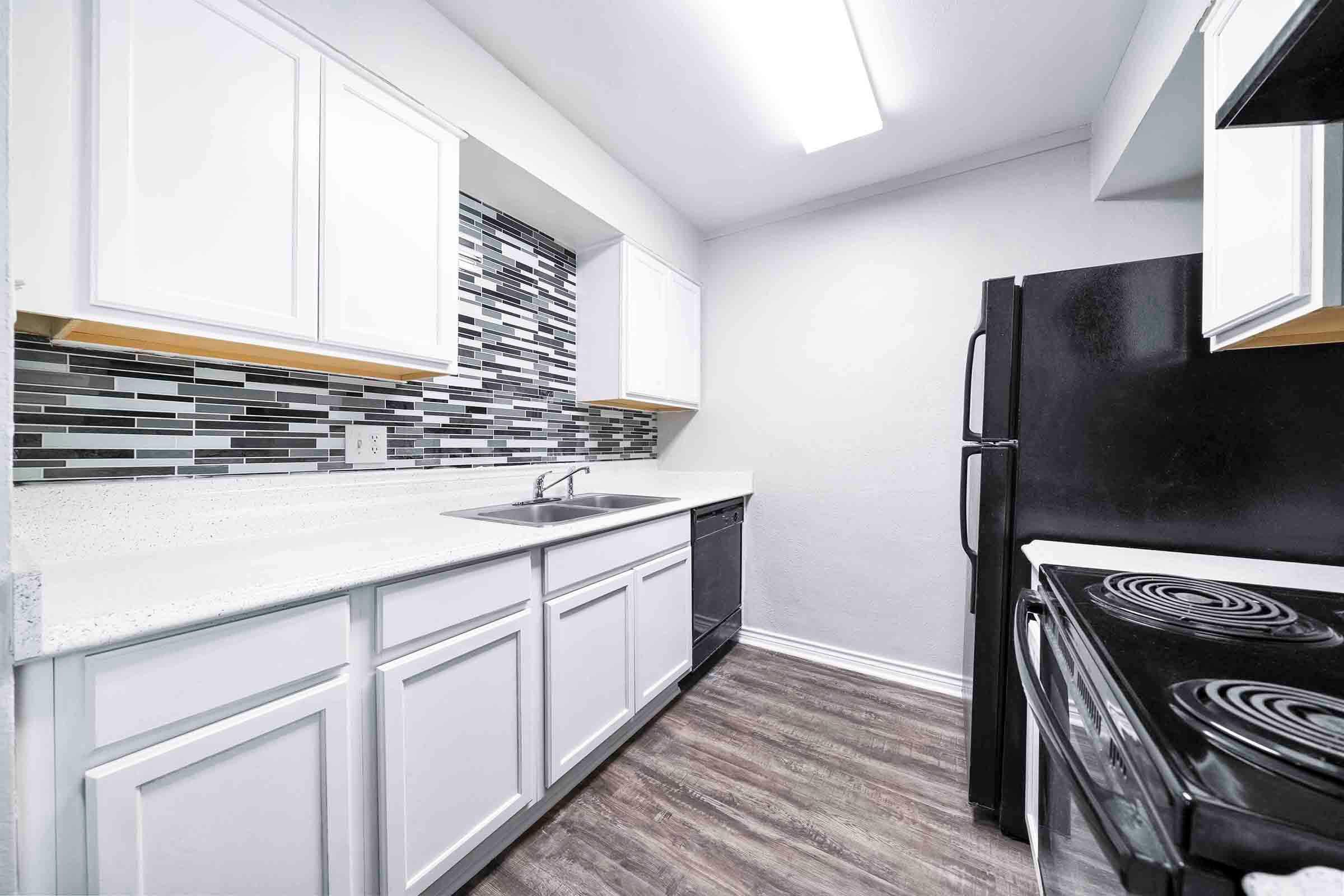 a kitchen with a sink and a window