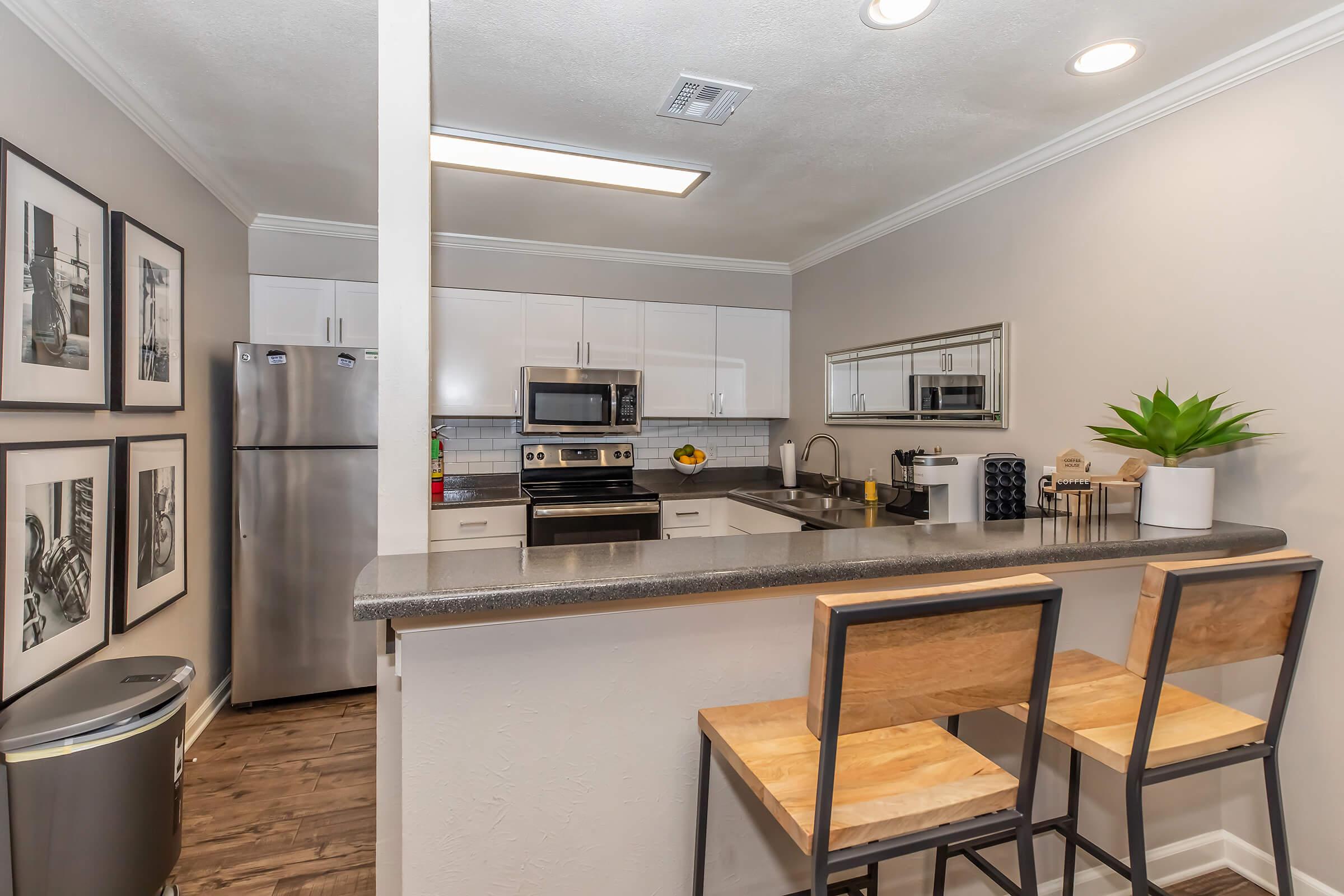 a kitchen with a table in a room