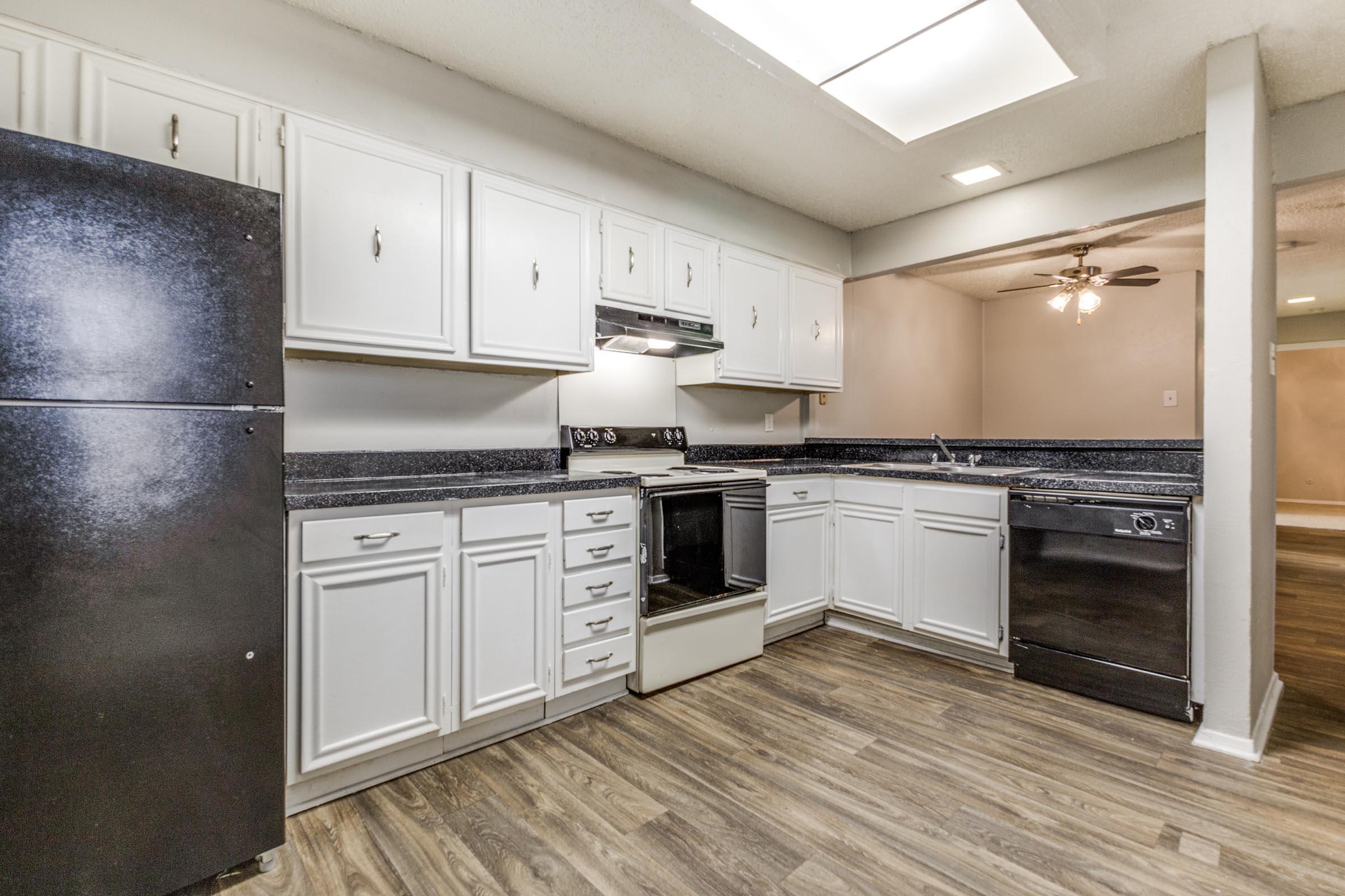 a kitchen with a stove and a refrigerator