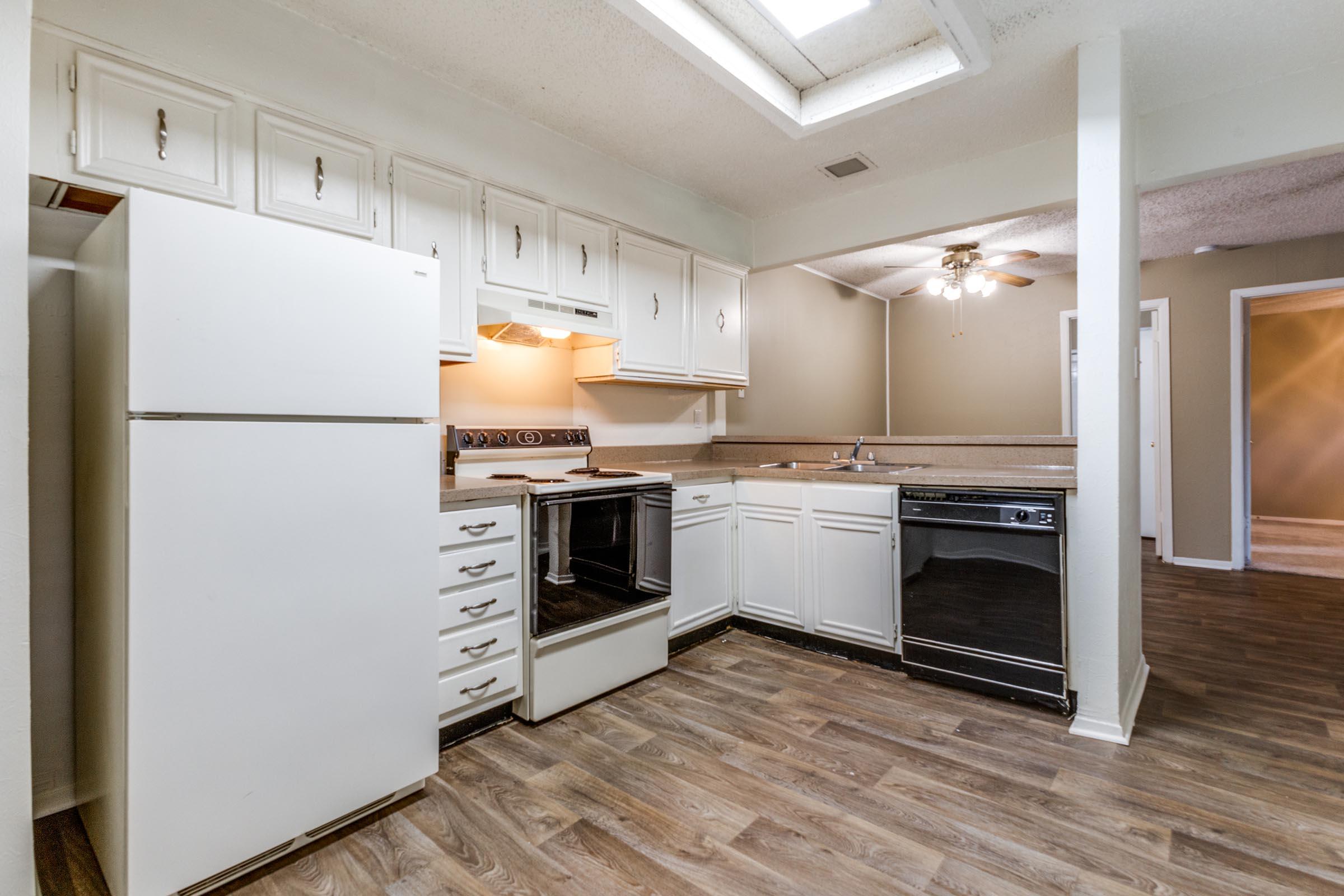 a kitchen with a stove and a refrigerator