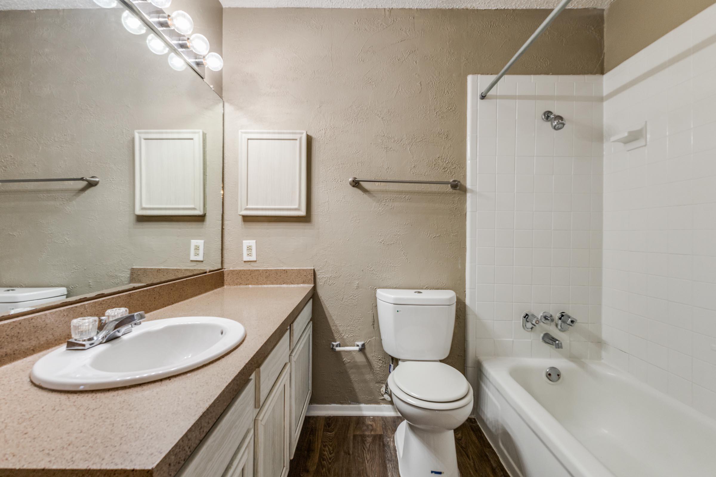 a restroom with a sink and a mirror