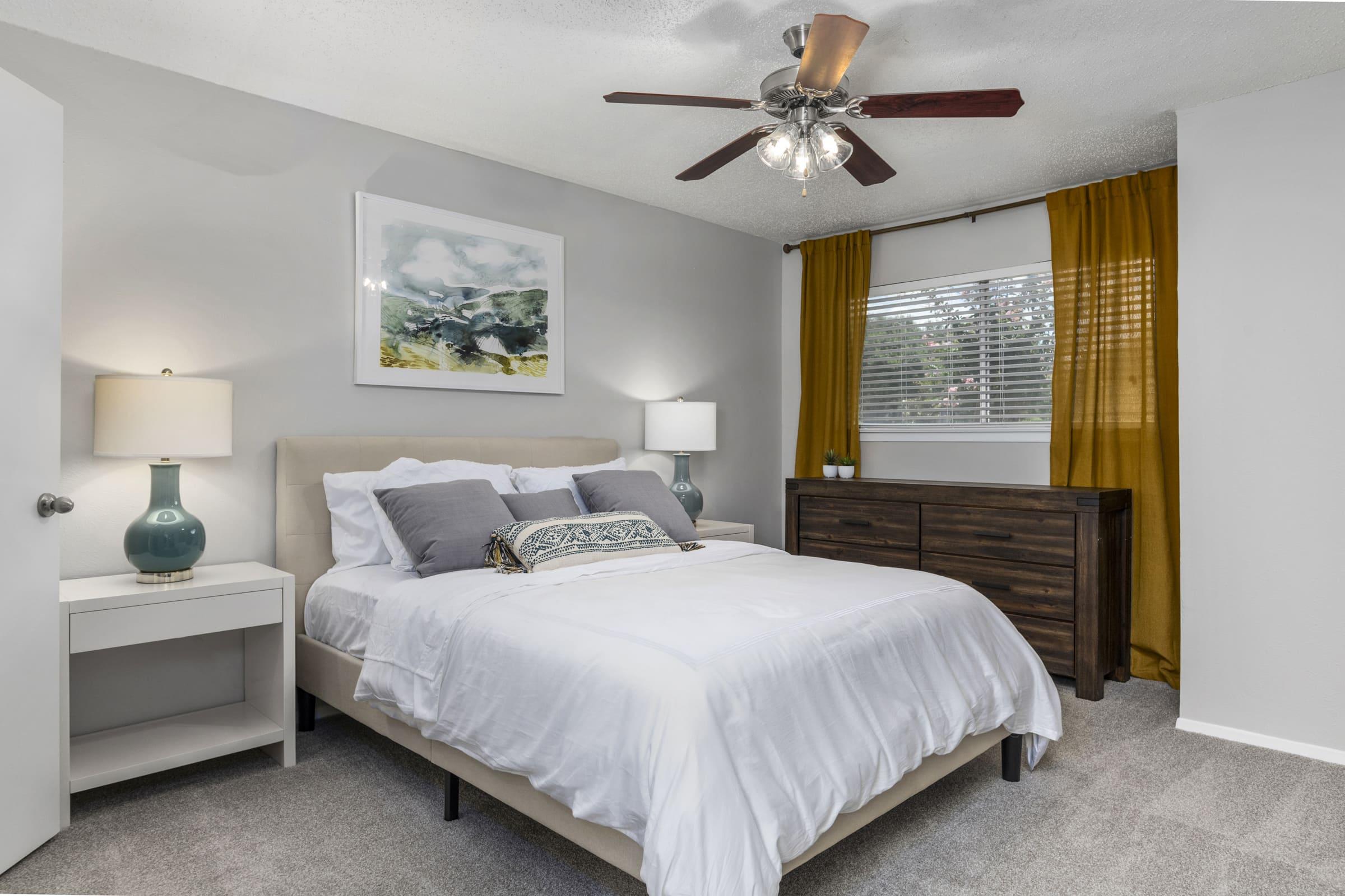 a bedroom with a large bed in a hotel room