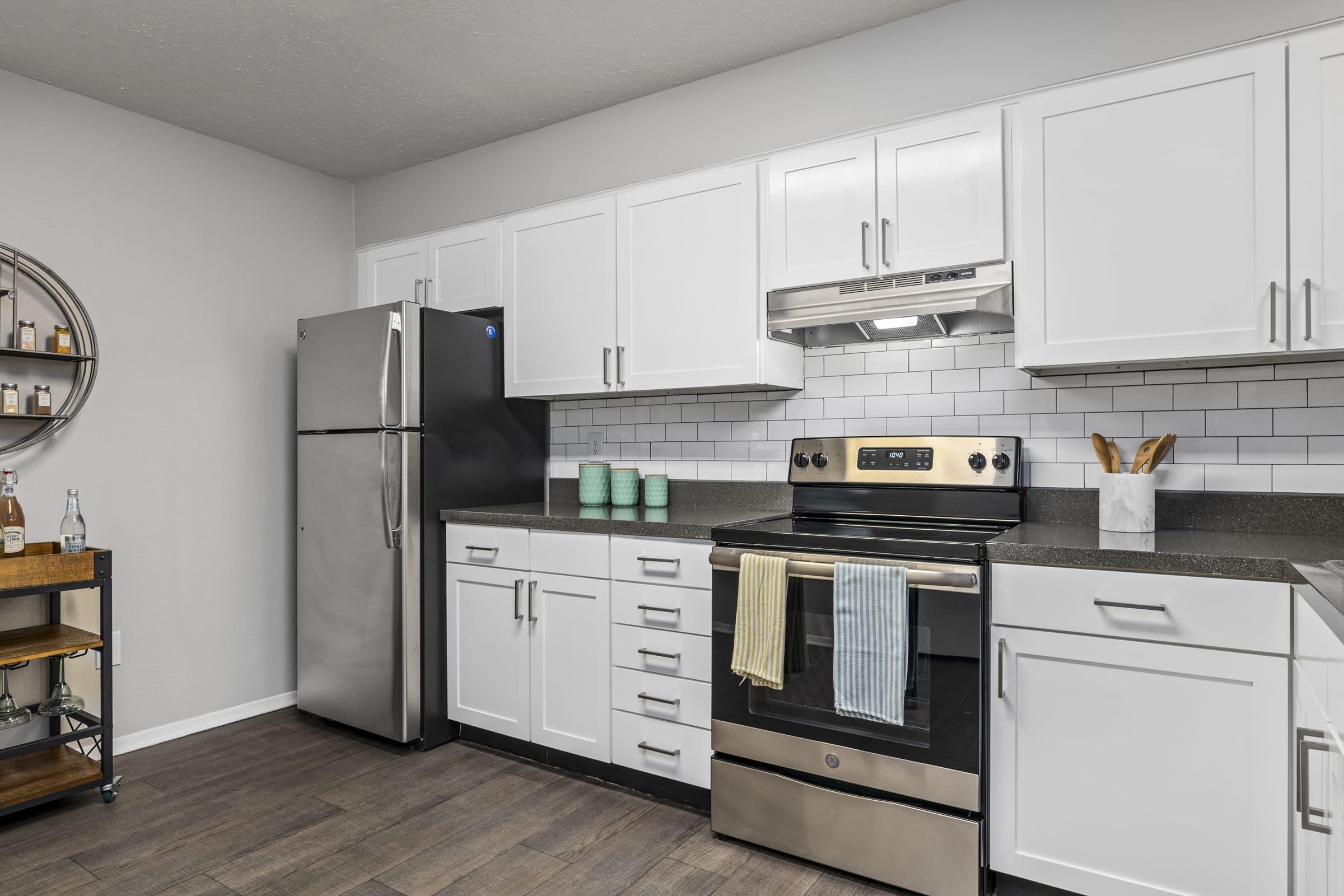 a large kitchen with stainless steel appliances