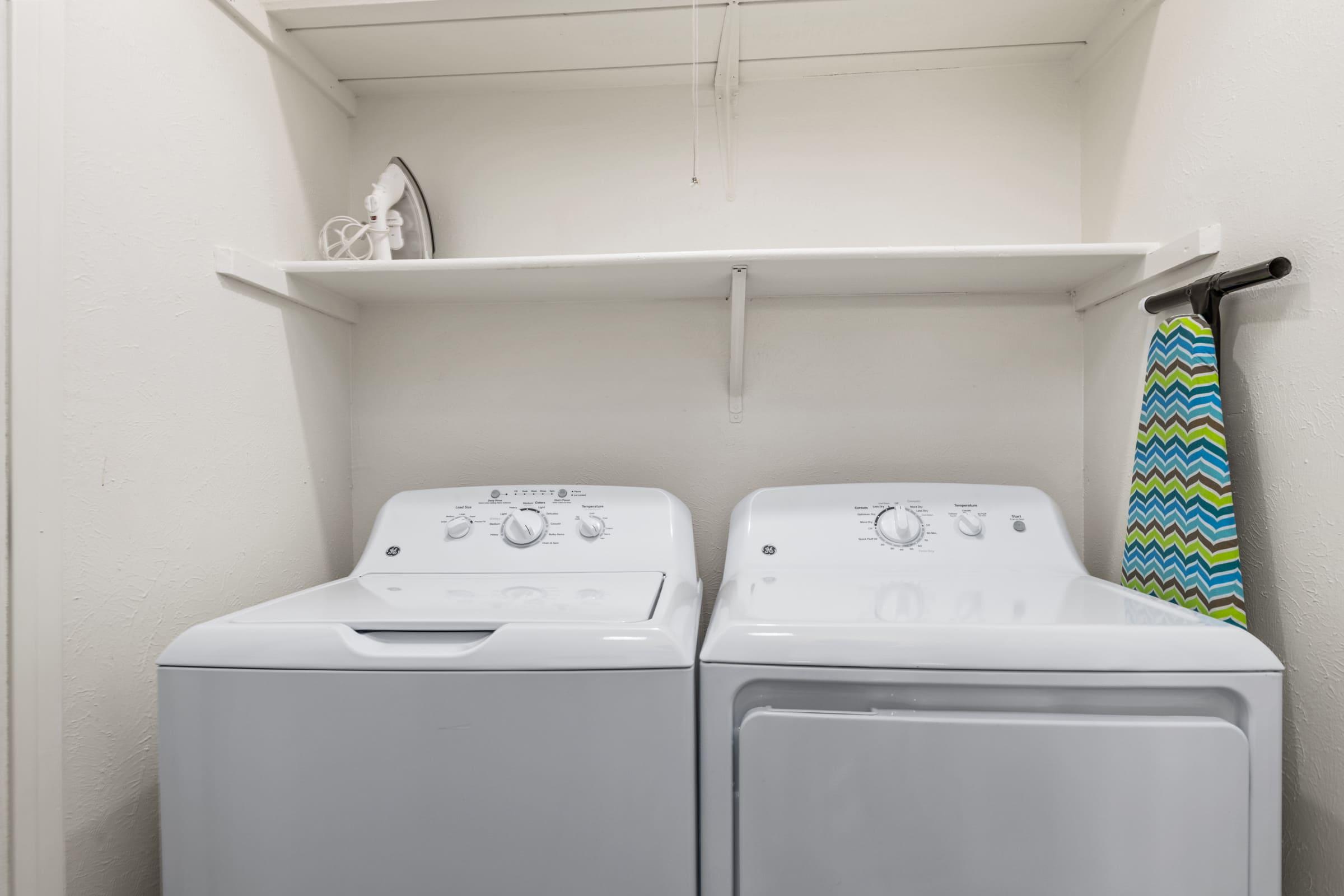 a refrigerator freezer sitting next to a sink