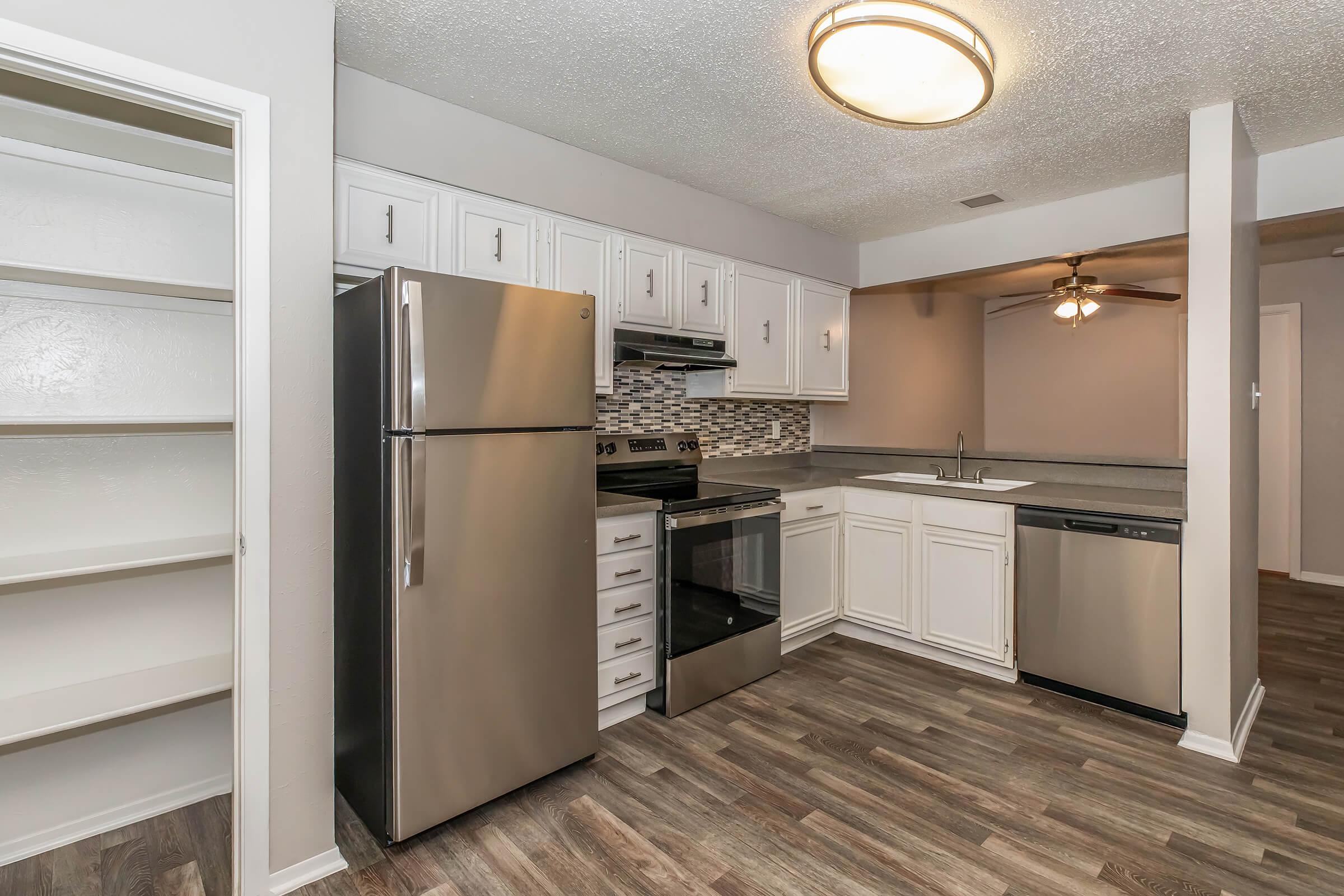 a stainless steel refrigerator in a kitchen