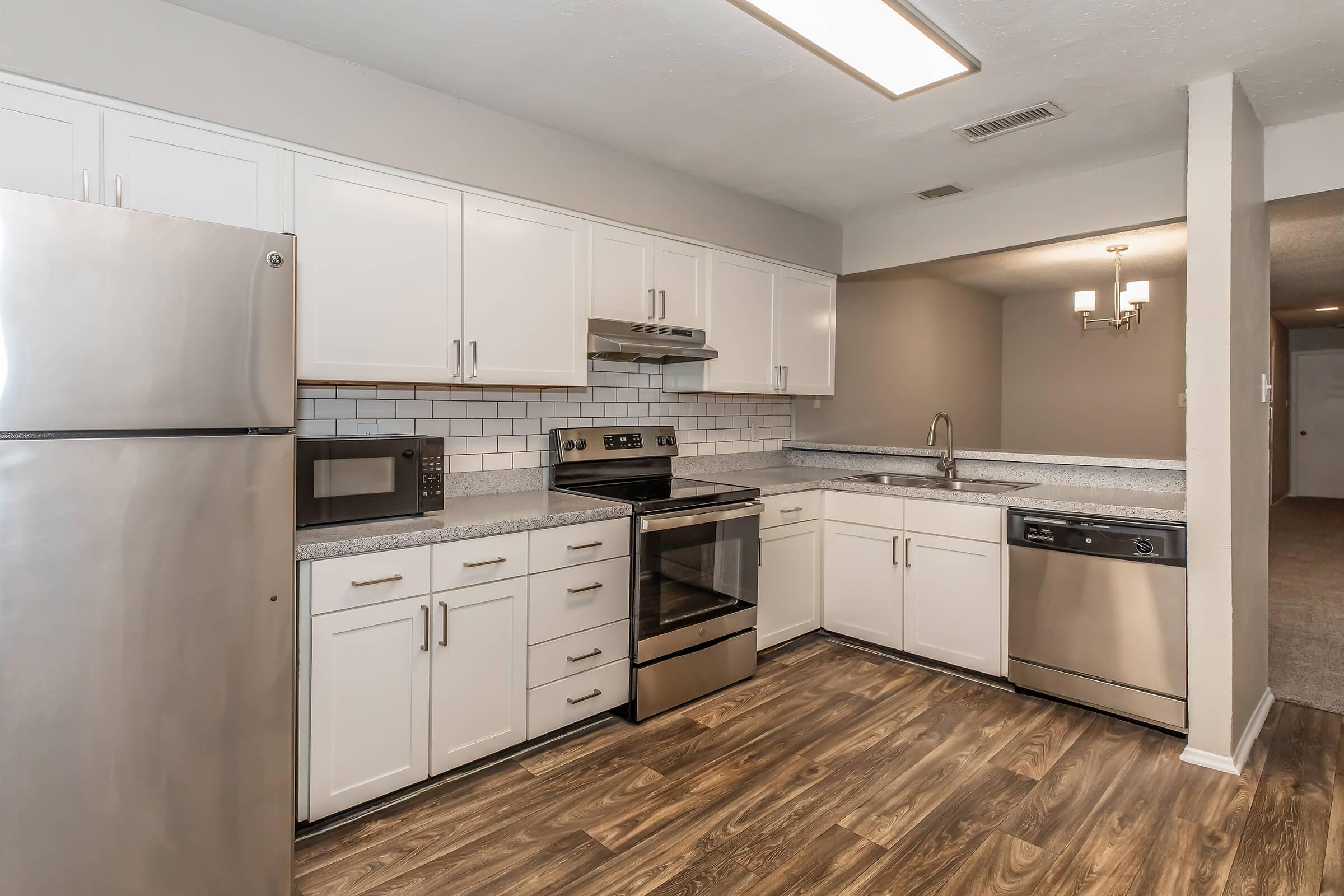 a large kitchen with stainless steel appliances