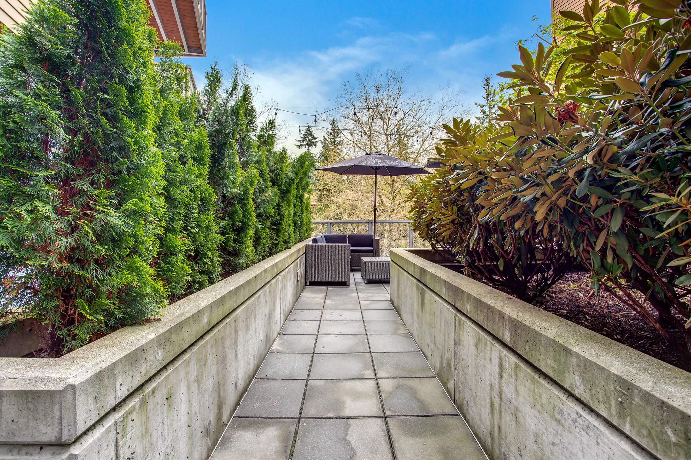 a stone bench in a garden