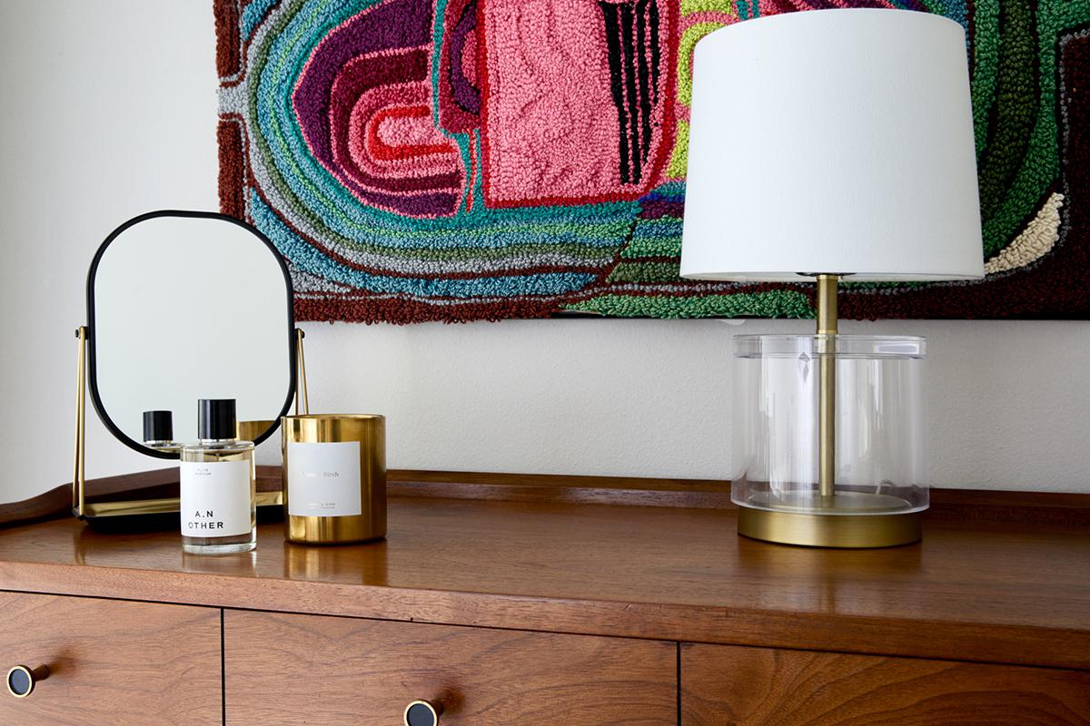 a vase sitting on top of a wooden table