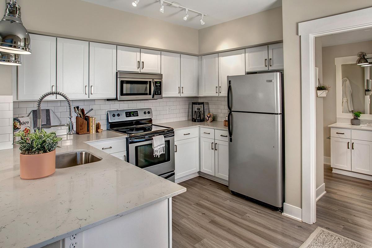 a large kitchen with stainless steel appliances