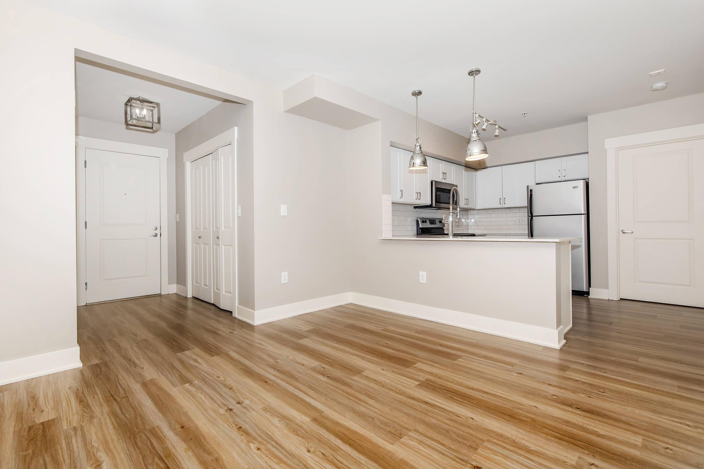 a kitchen with a wood floor