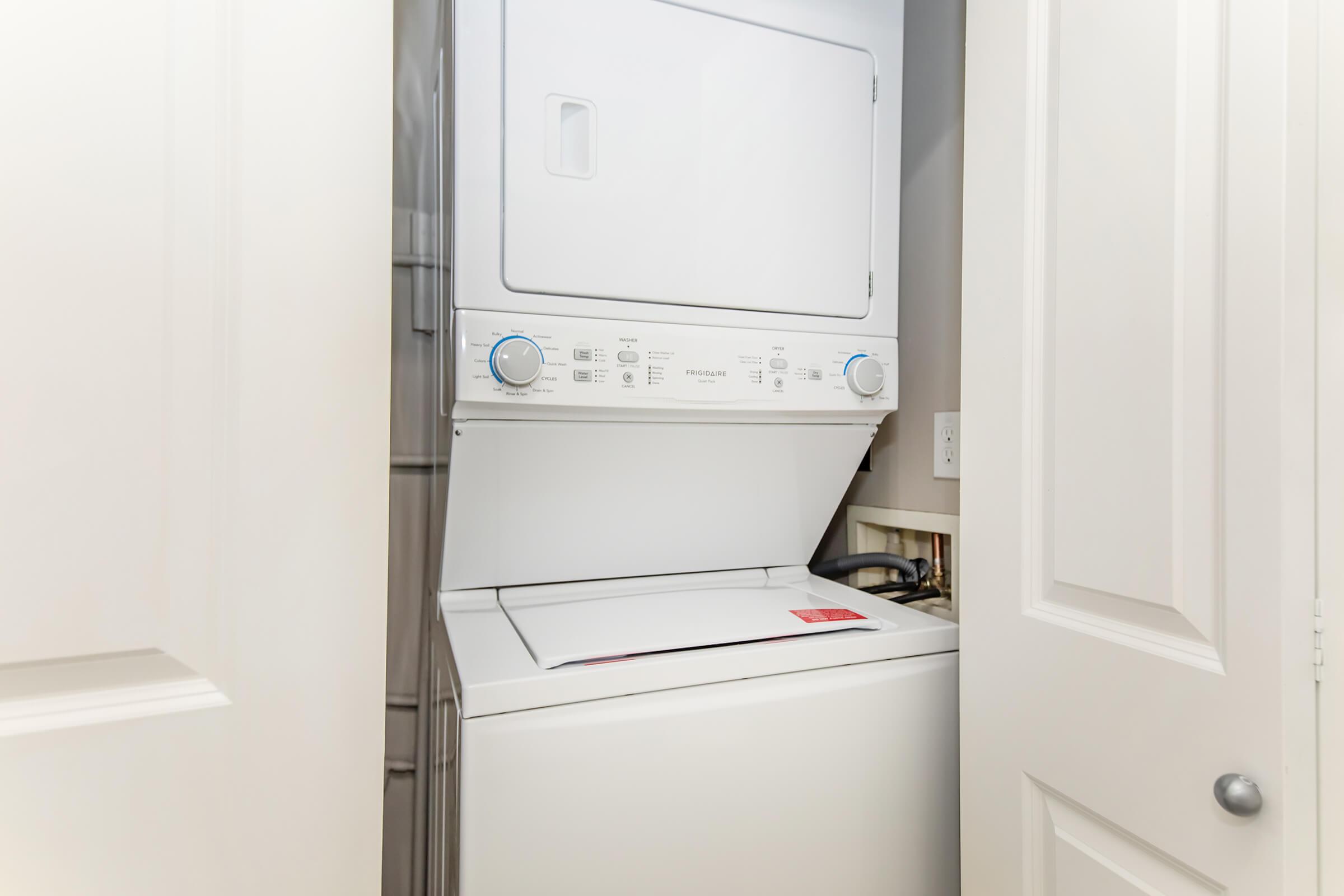 a microwave oven sitting on top of a refrigerator