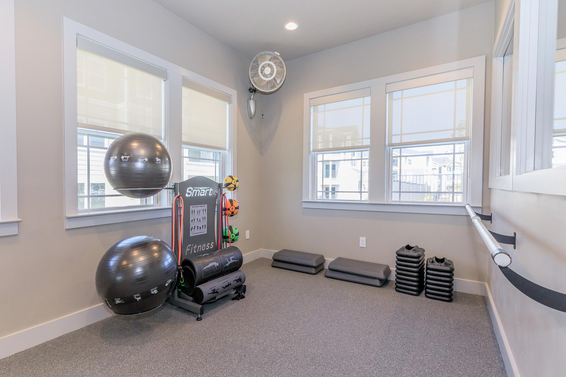 a room filled with furniture and a large window