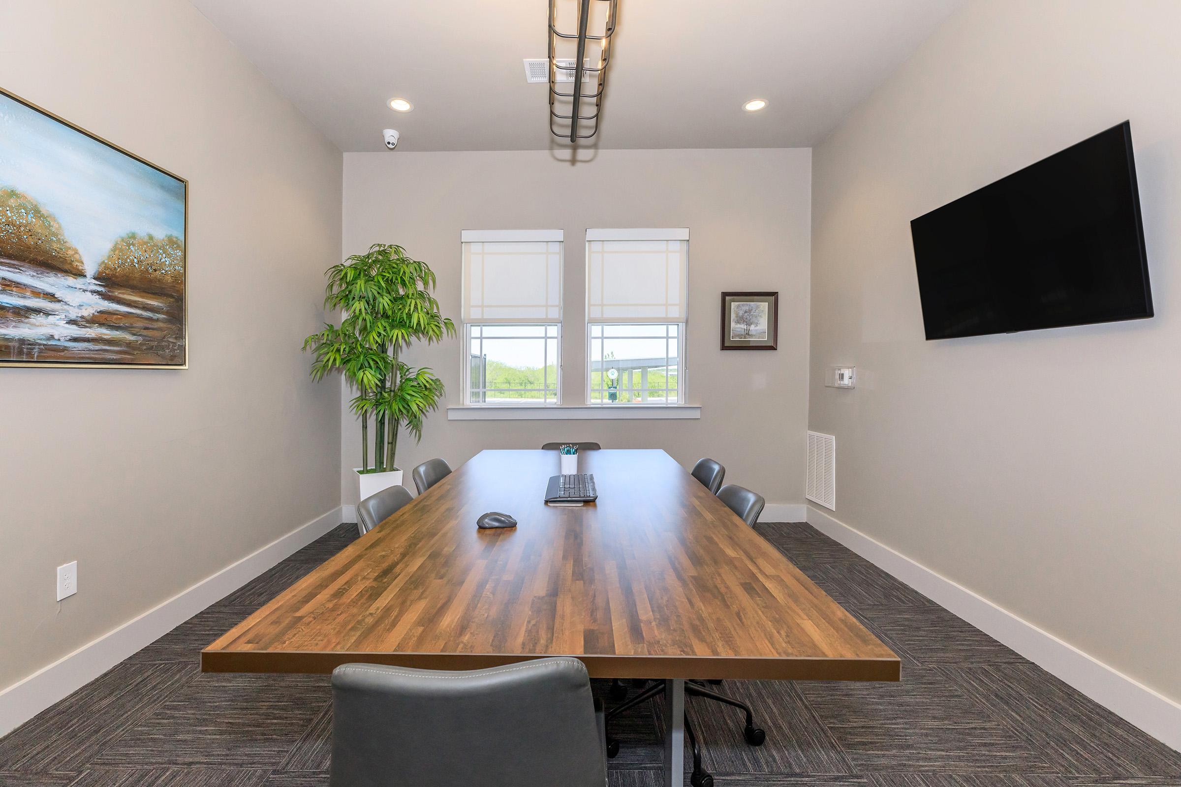 a view of a living room with a wooden table