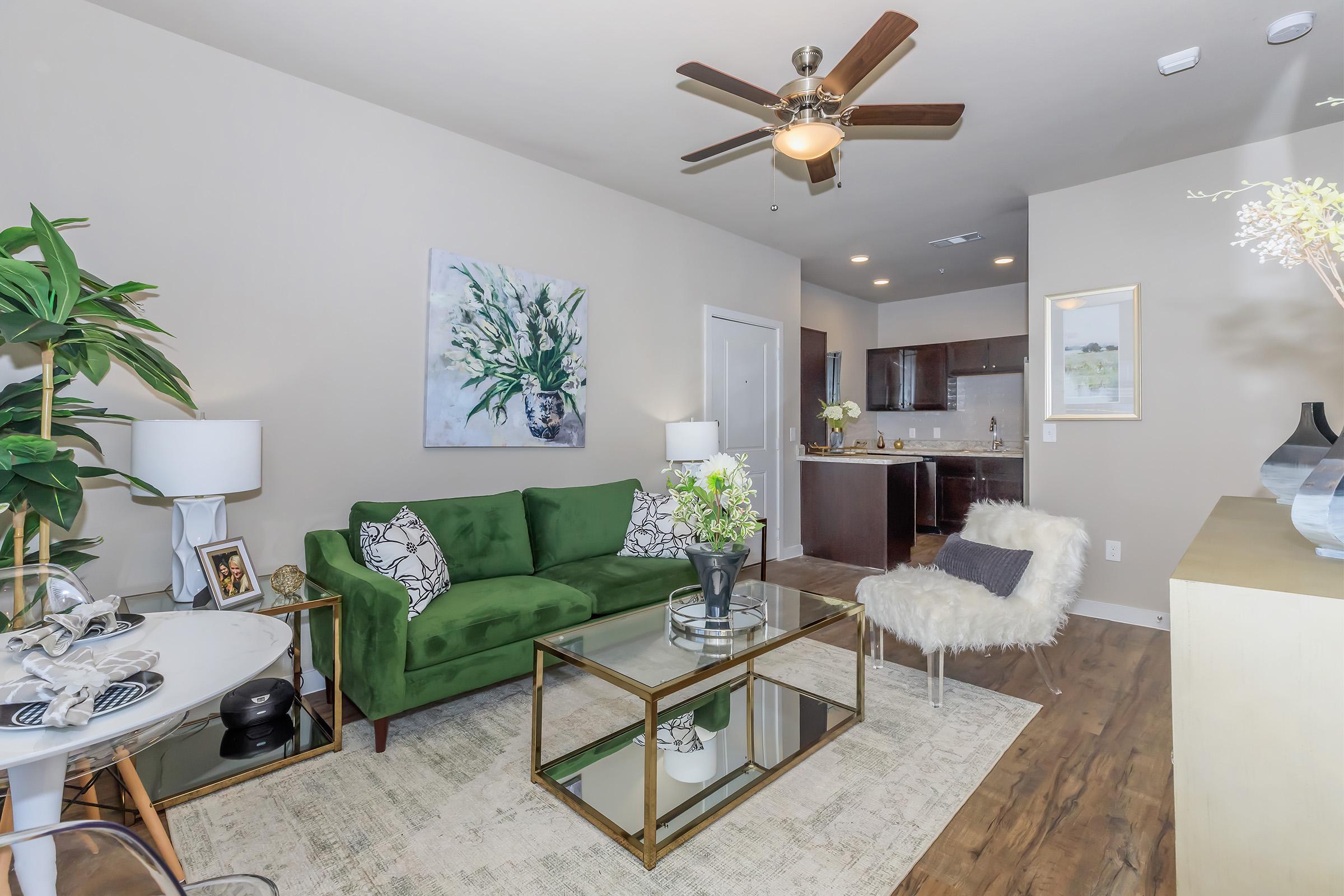 a living room filled with furniture and a table