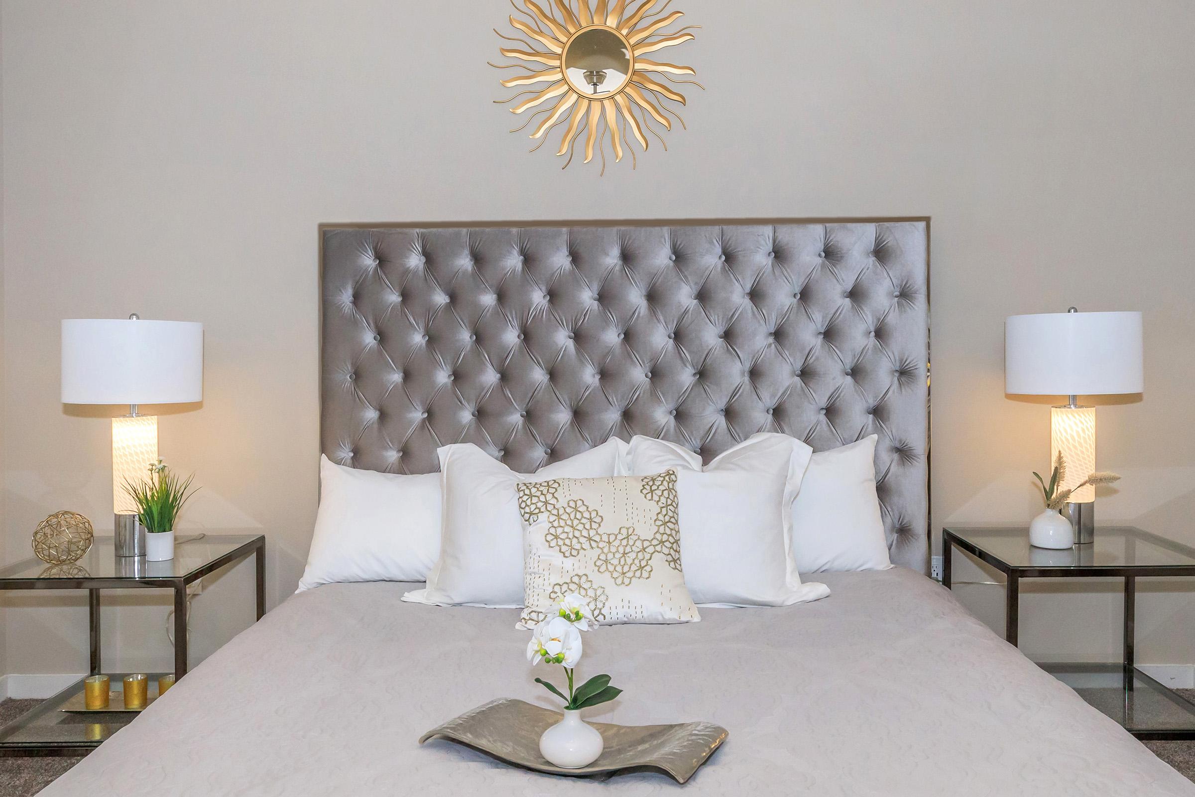 a bedroom with a large bed in a hotel room