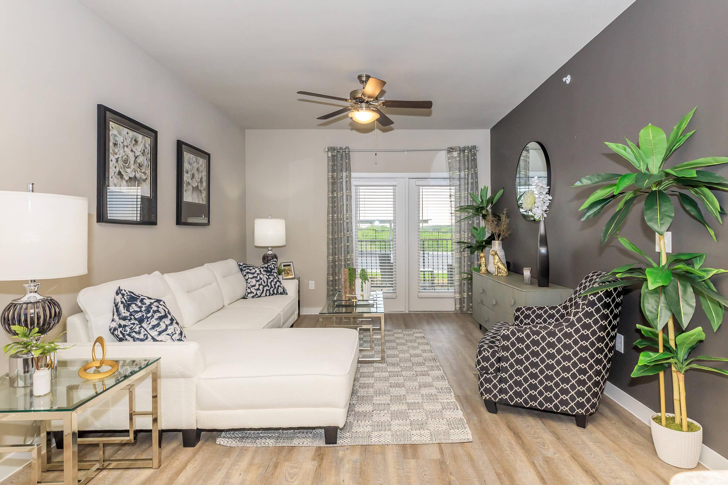 a living room filled with furniture and a fireplace