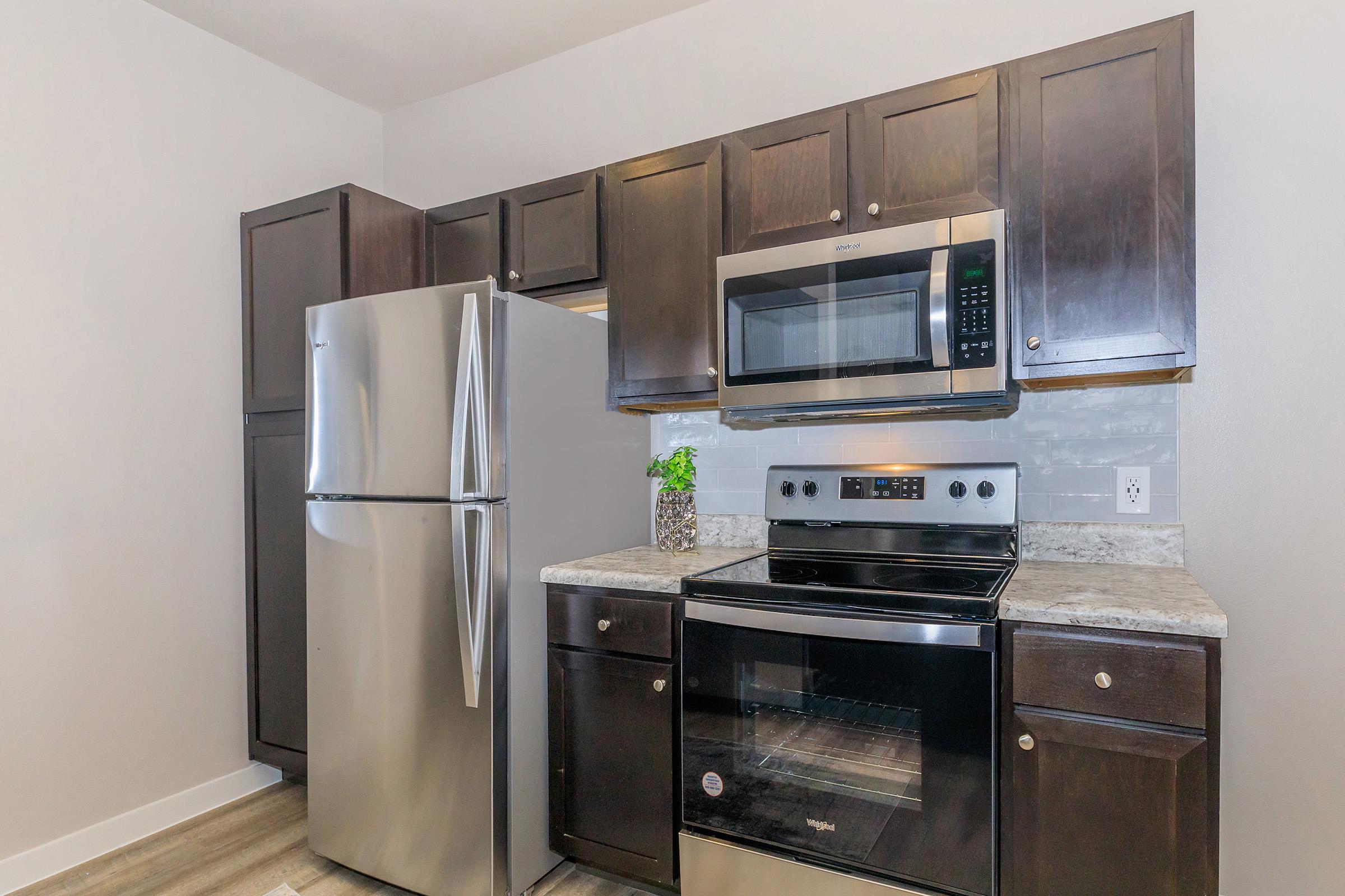 a kitchen with a stove top oven sitting inside of a refrigerator