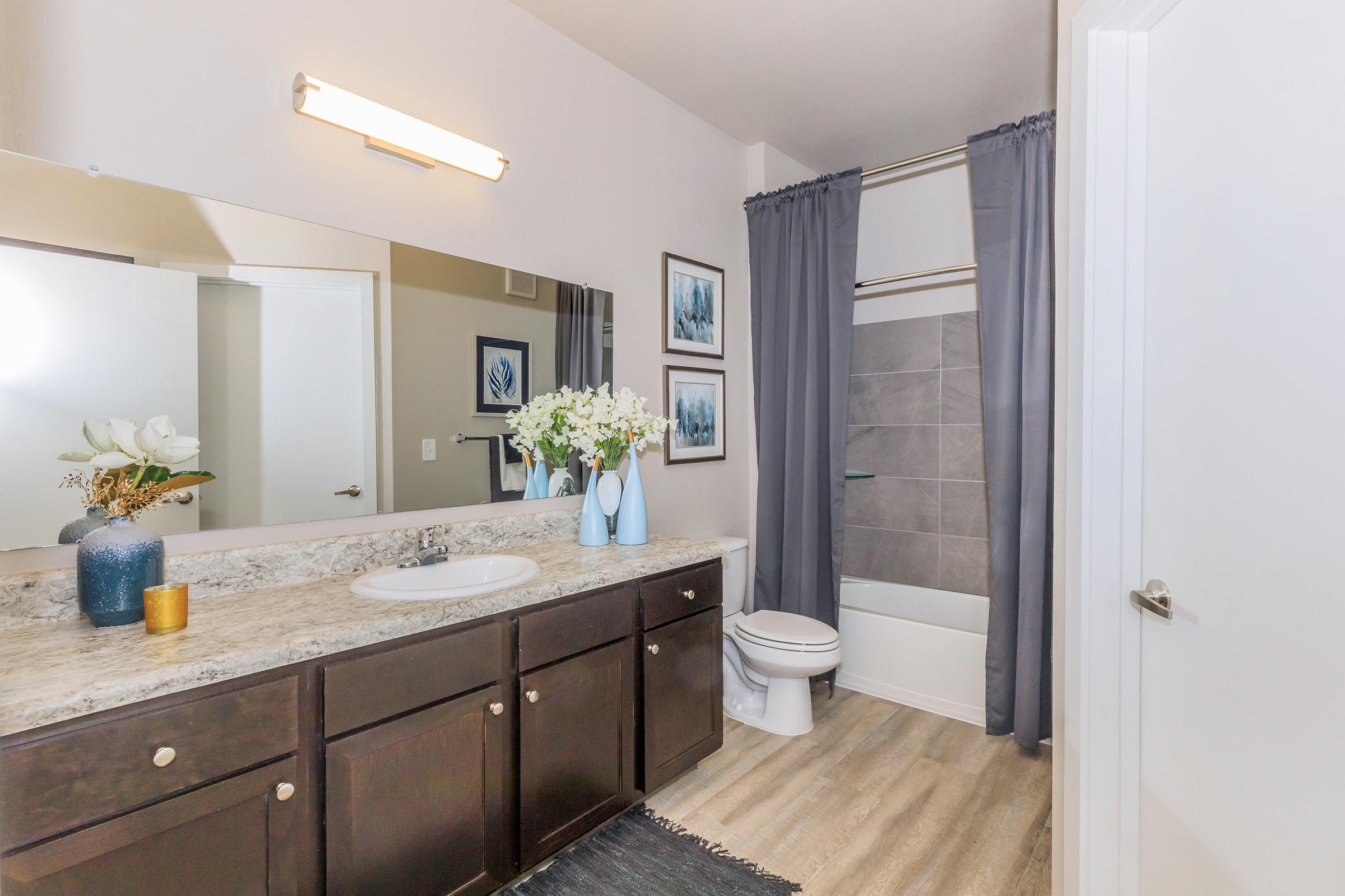 a kitchen with a sink and a mirror