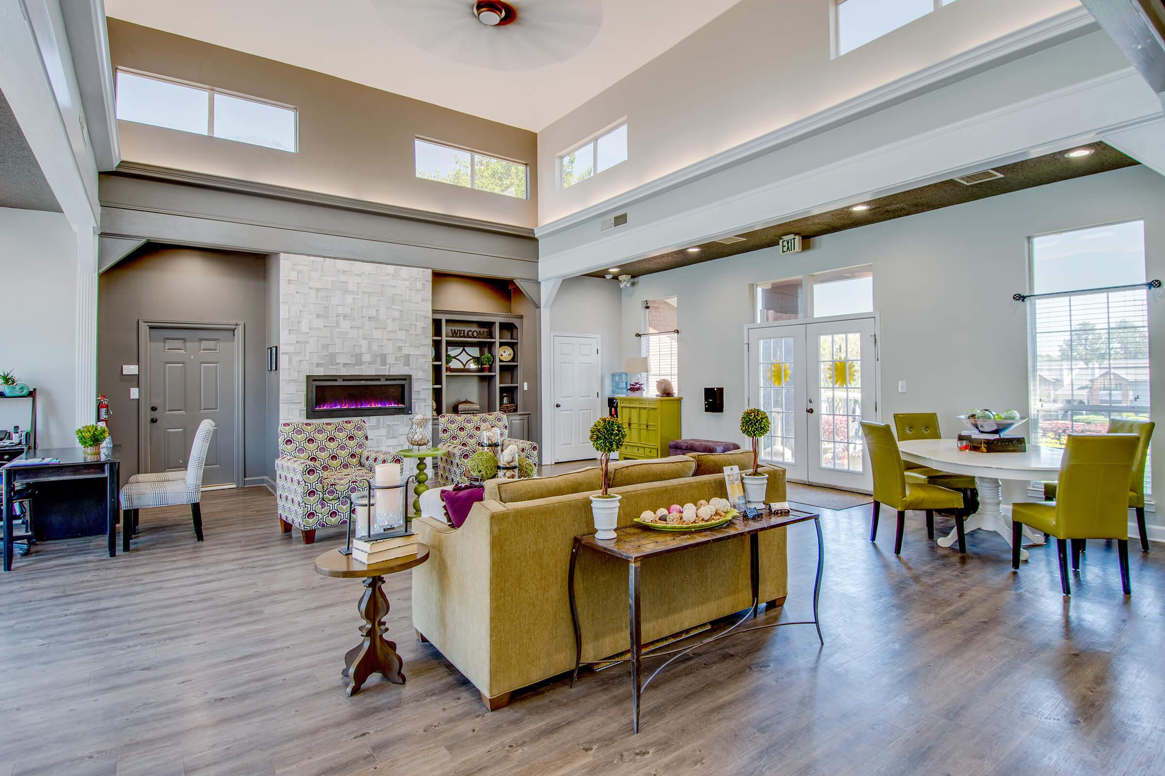 a living room filled with furniture and a fireplace