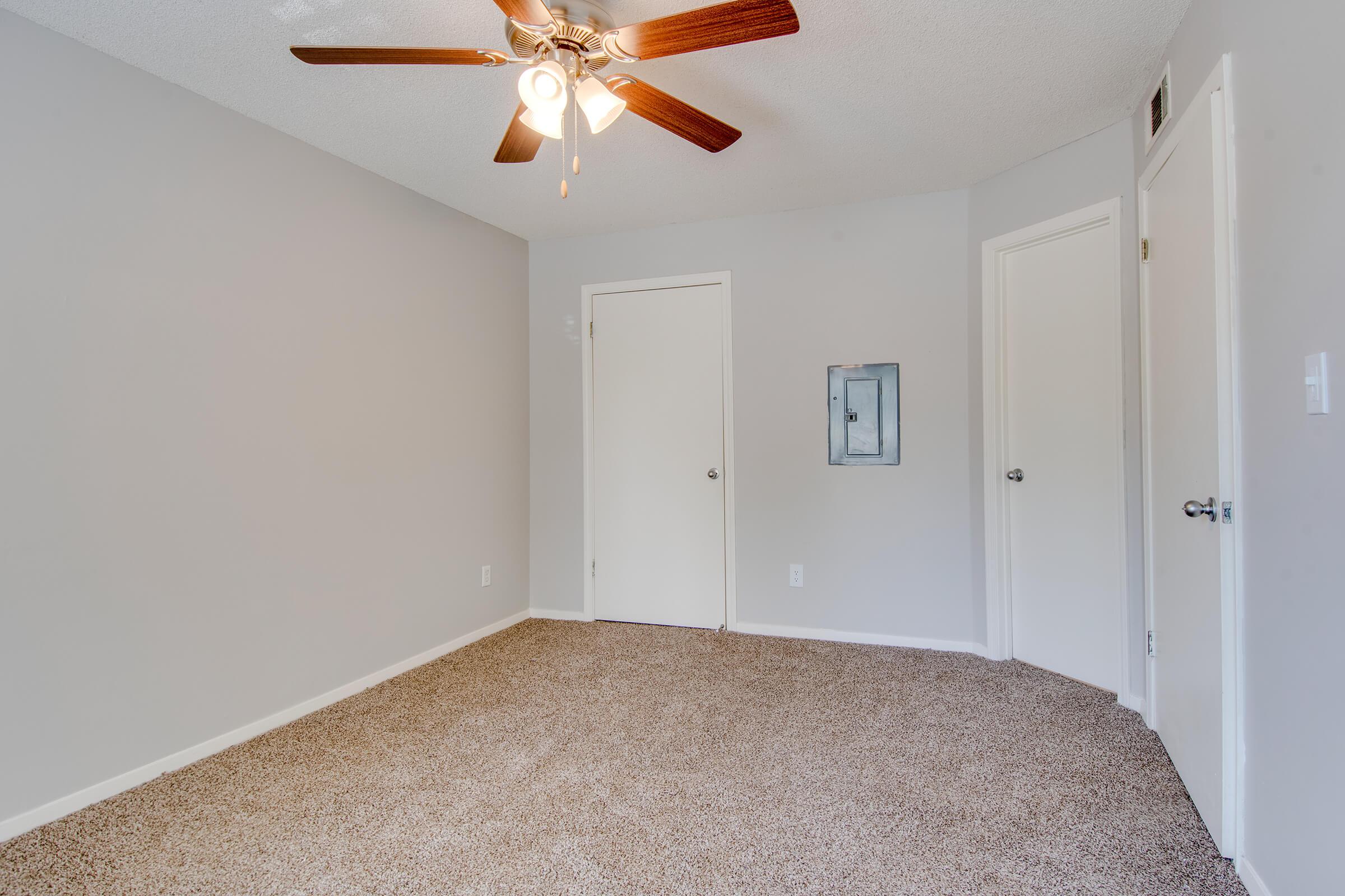 a bedroom with a bed in a room