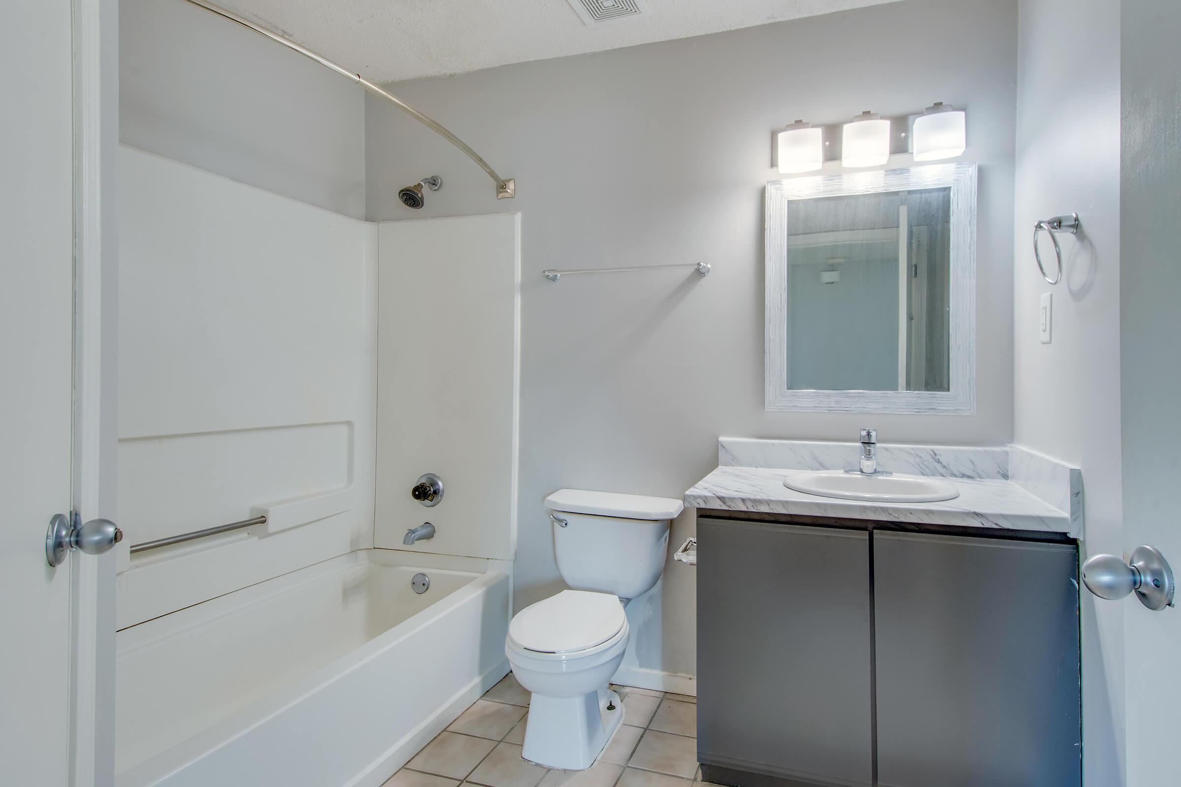 a room with a sink and a shower