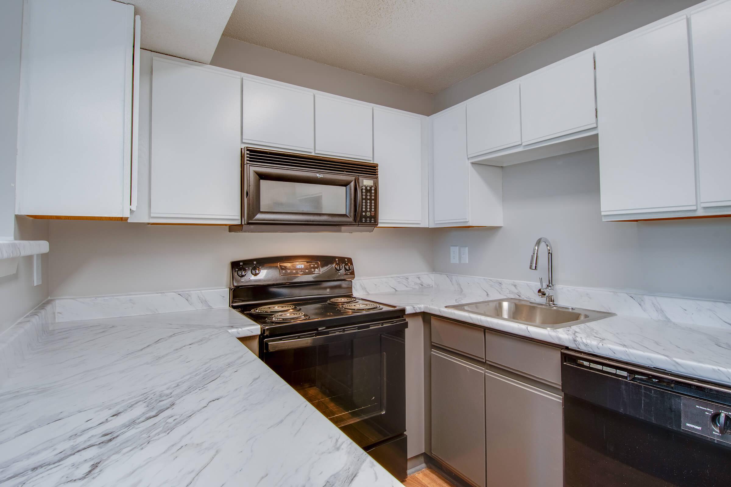 a kitchen with a stove and a sink