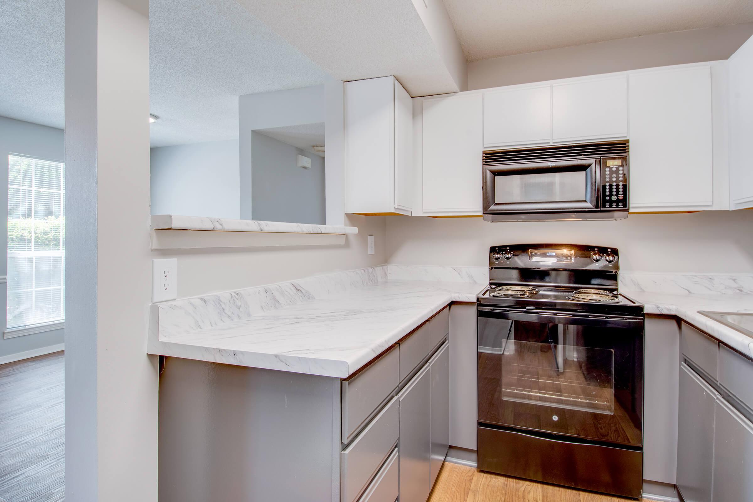 a kitchen with a stove and a refrigerator