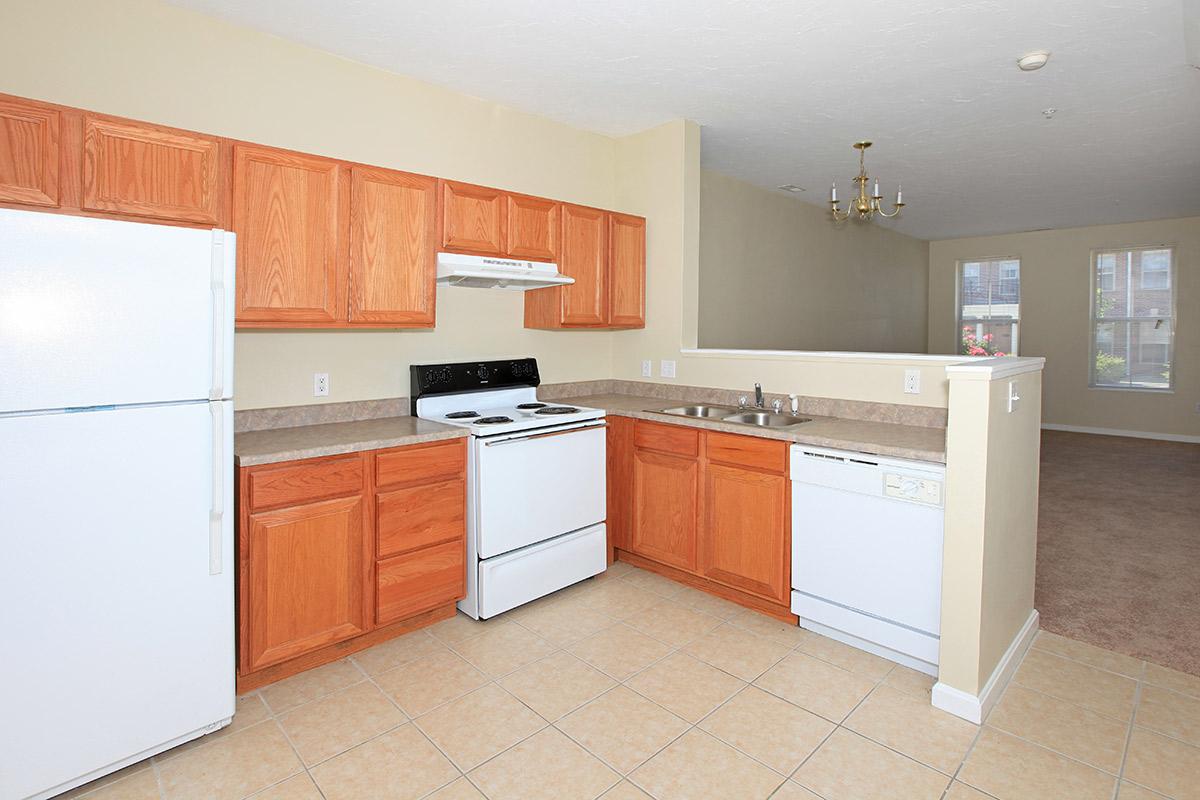 a large white refrigerator in a kitchen