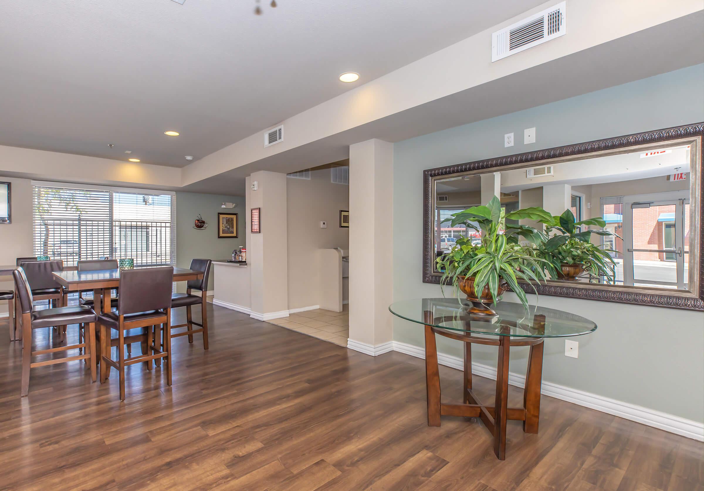 a living room filled with furniture and a large window