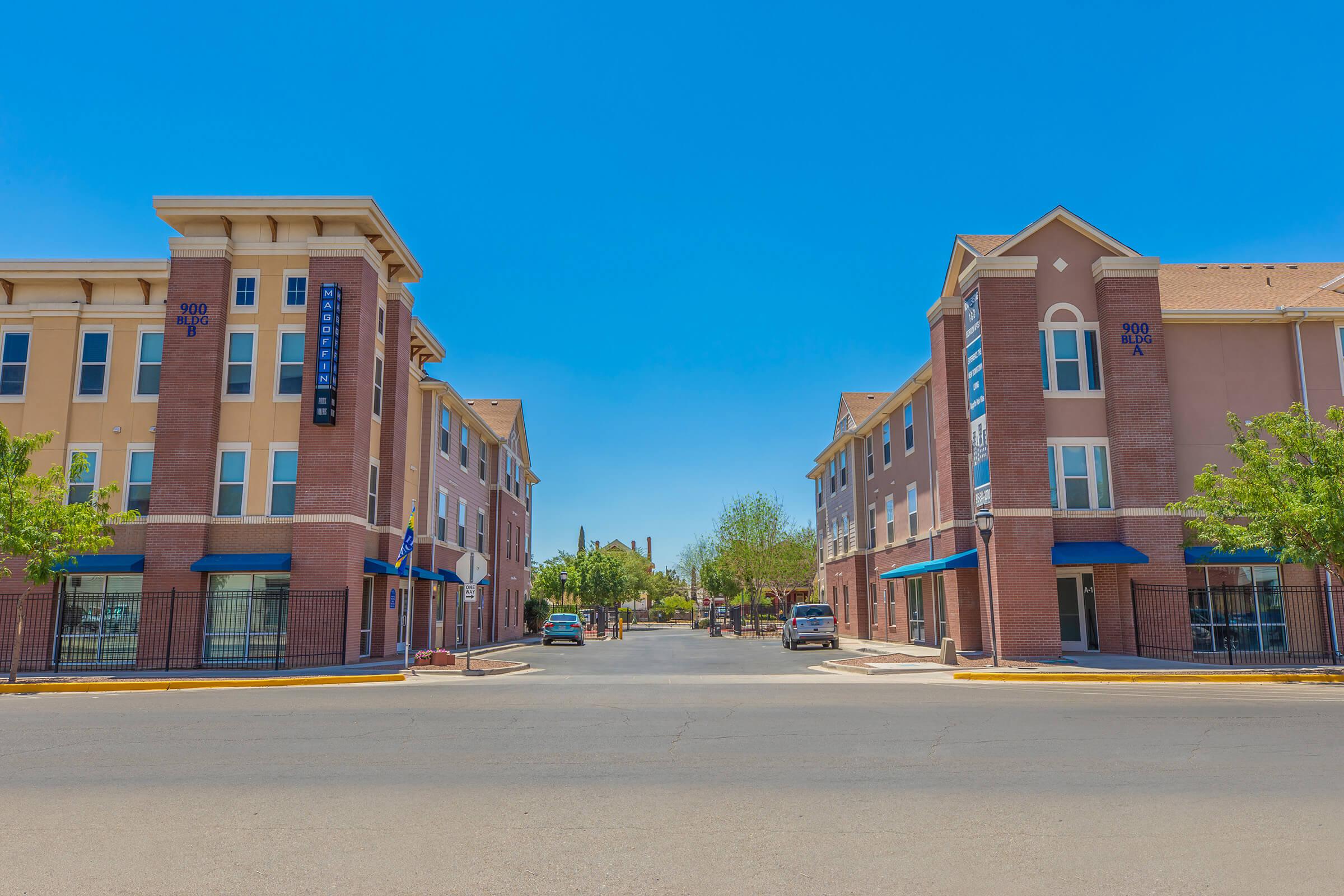 a close up of a street in front of a brick building