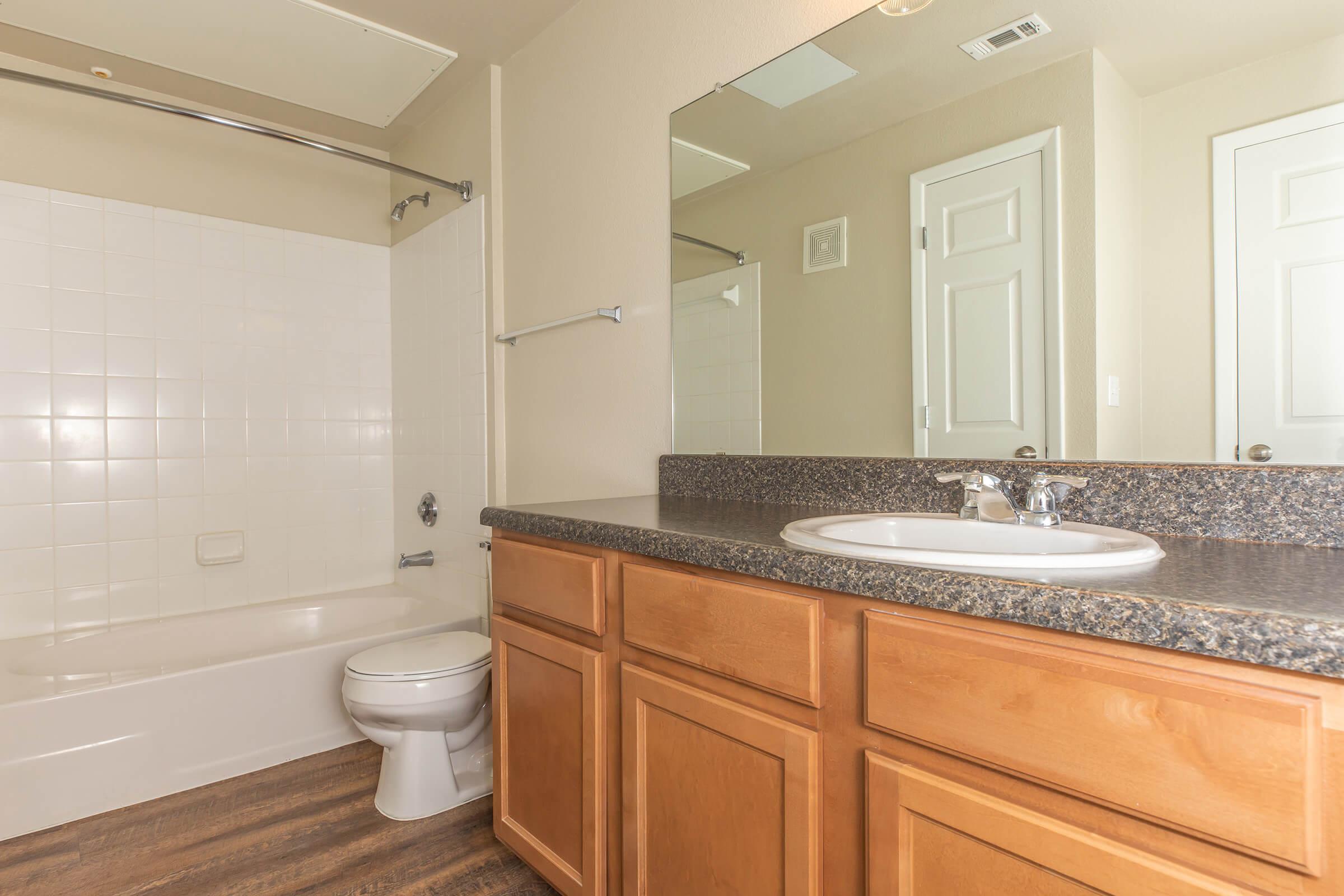 a kitchen with a sink and a mirror