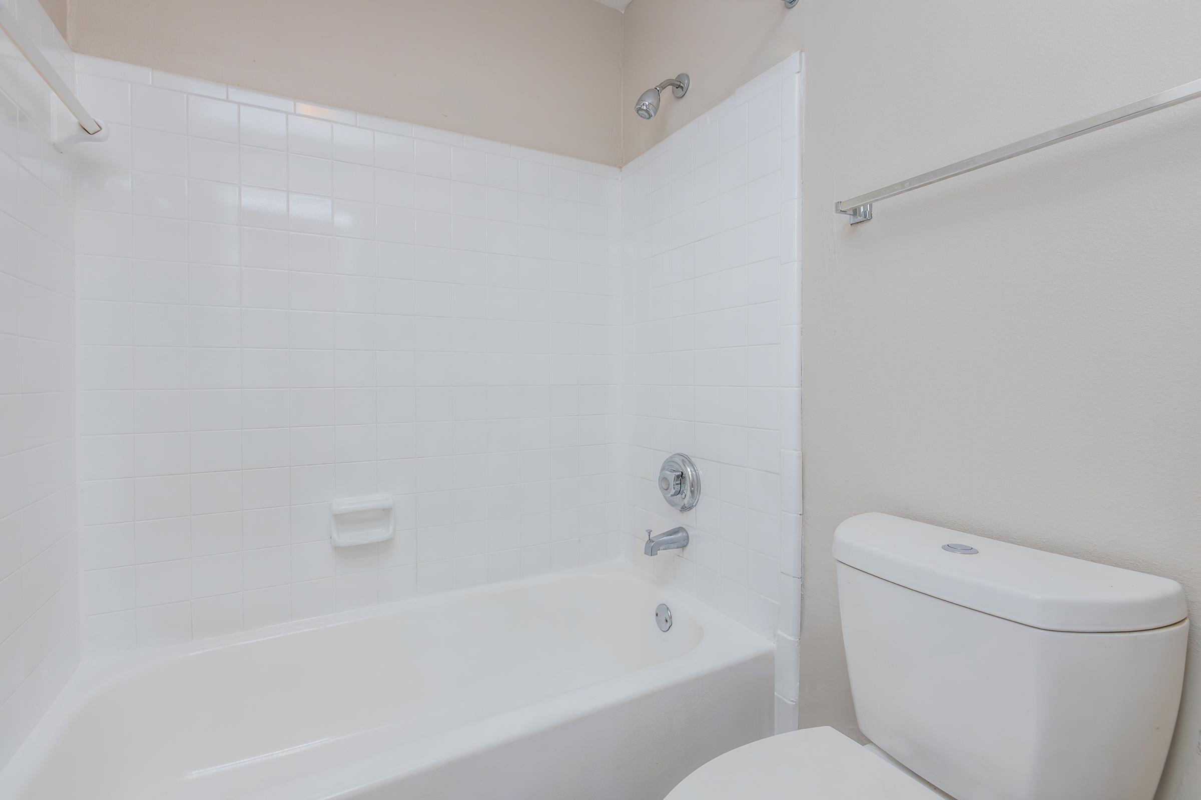 a room with a sink and a bath tub