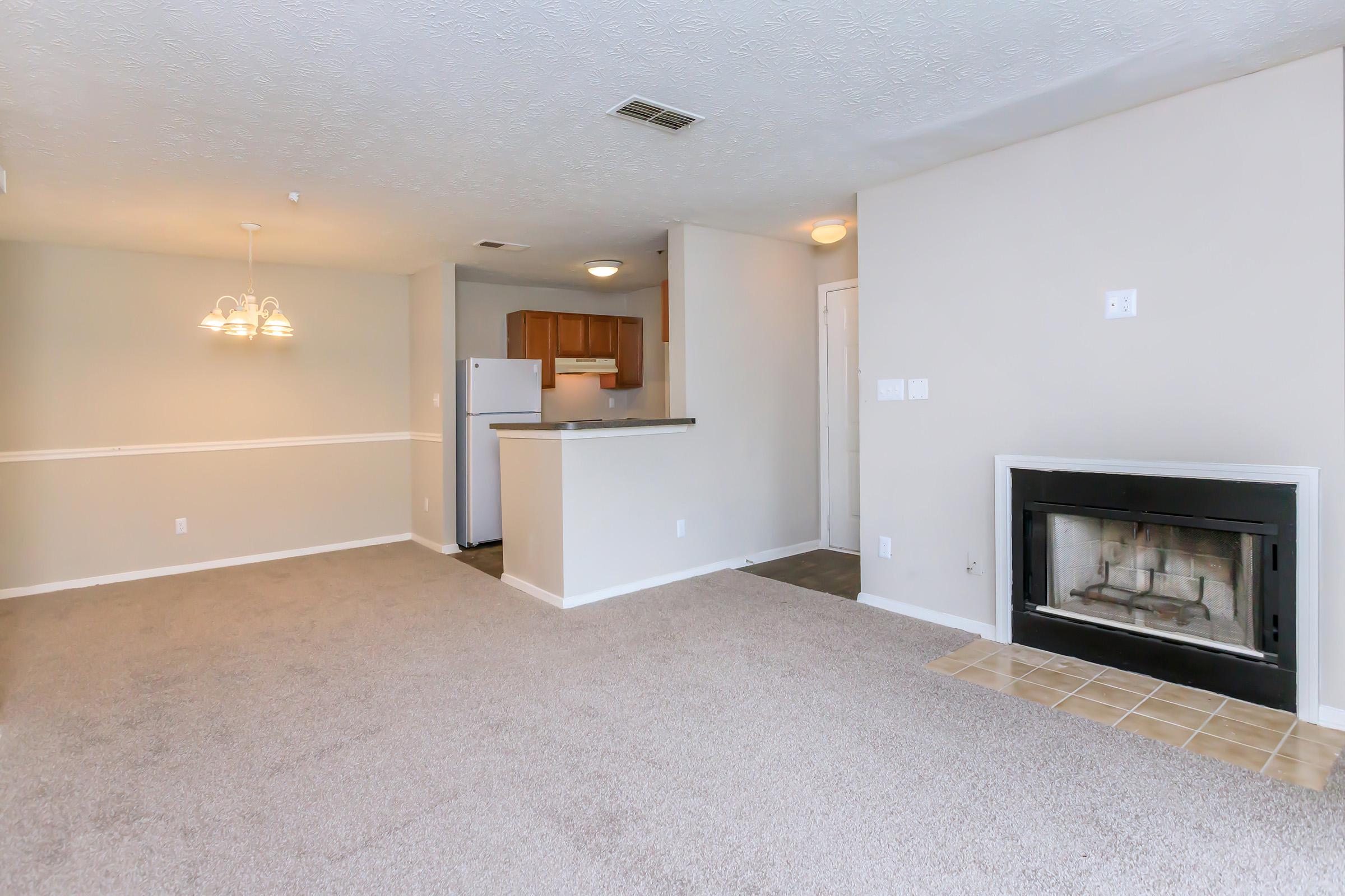 a living room filled with furniture and a flat screen tv