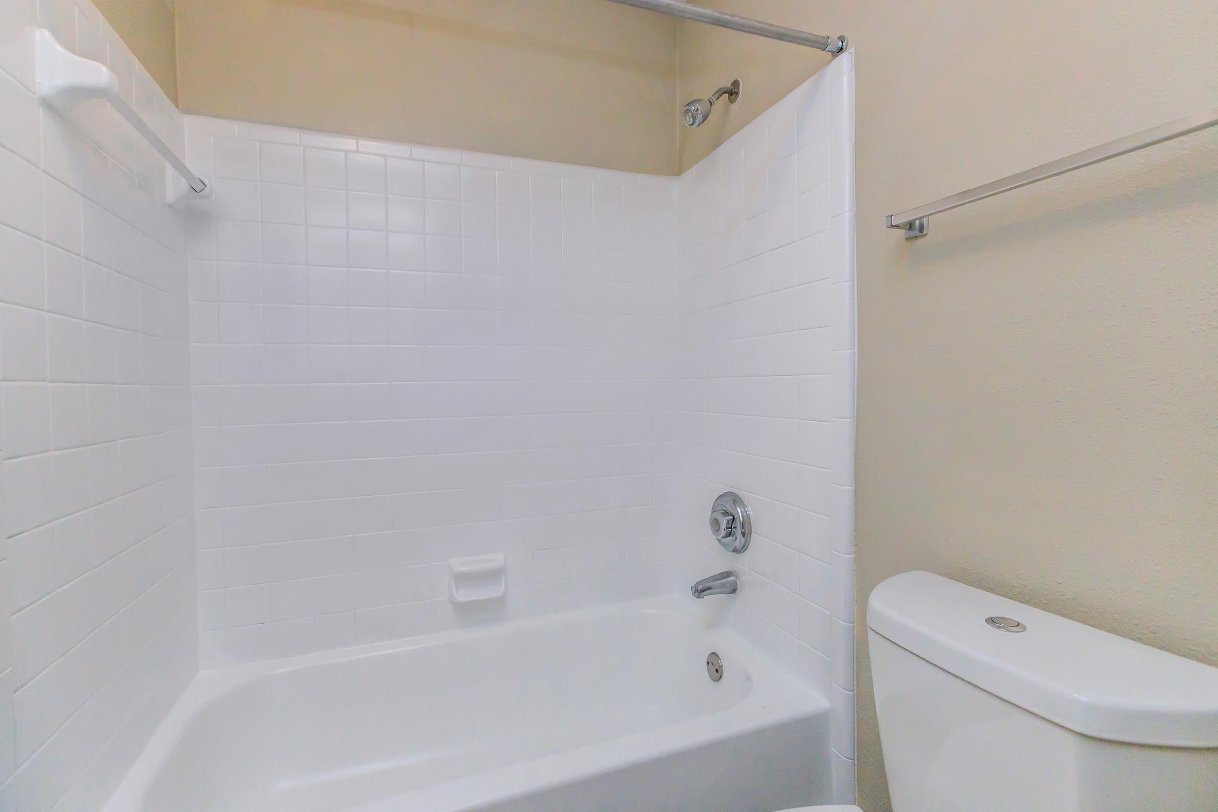 a close up of a sink and a bath tub