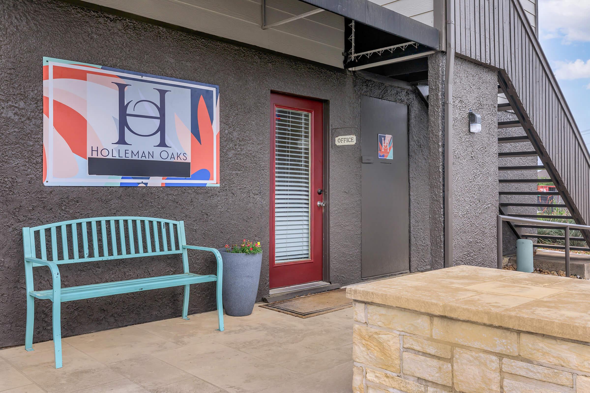 a chair sitting in front of a brick building