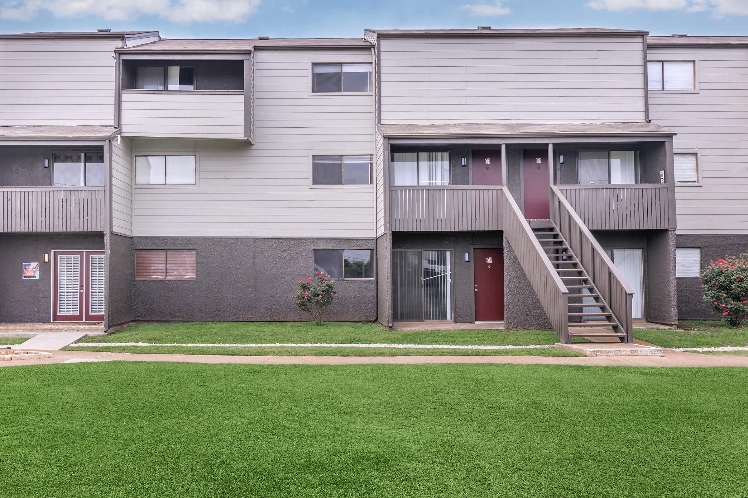 a large lawn in front of a house