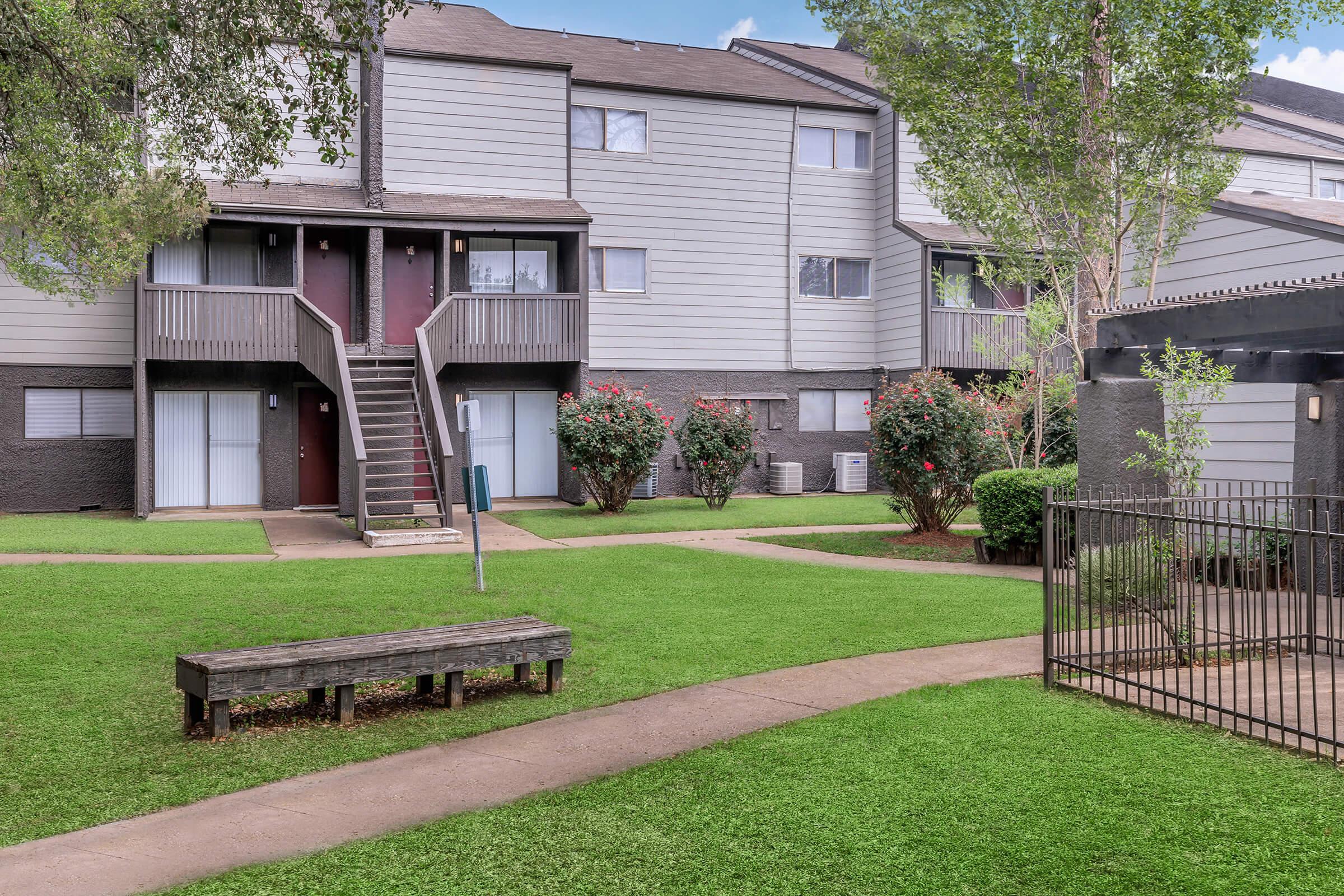 a large lawn in front of a house