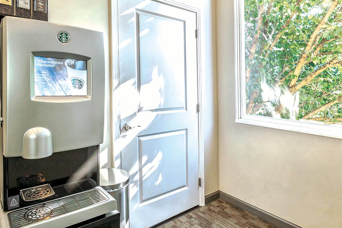 a white refrigerator freezer sitting next to a window
