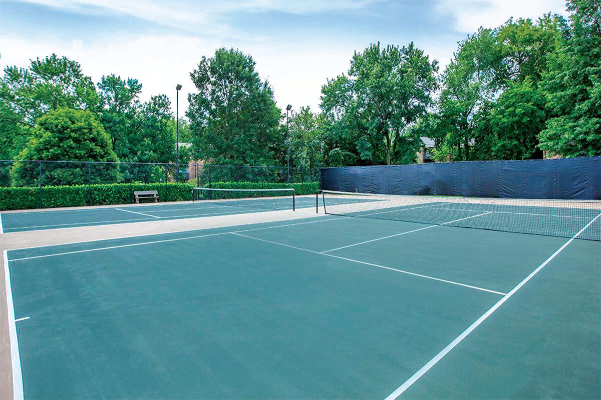 a person on a court with a racket