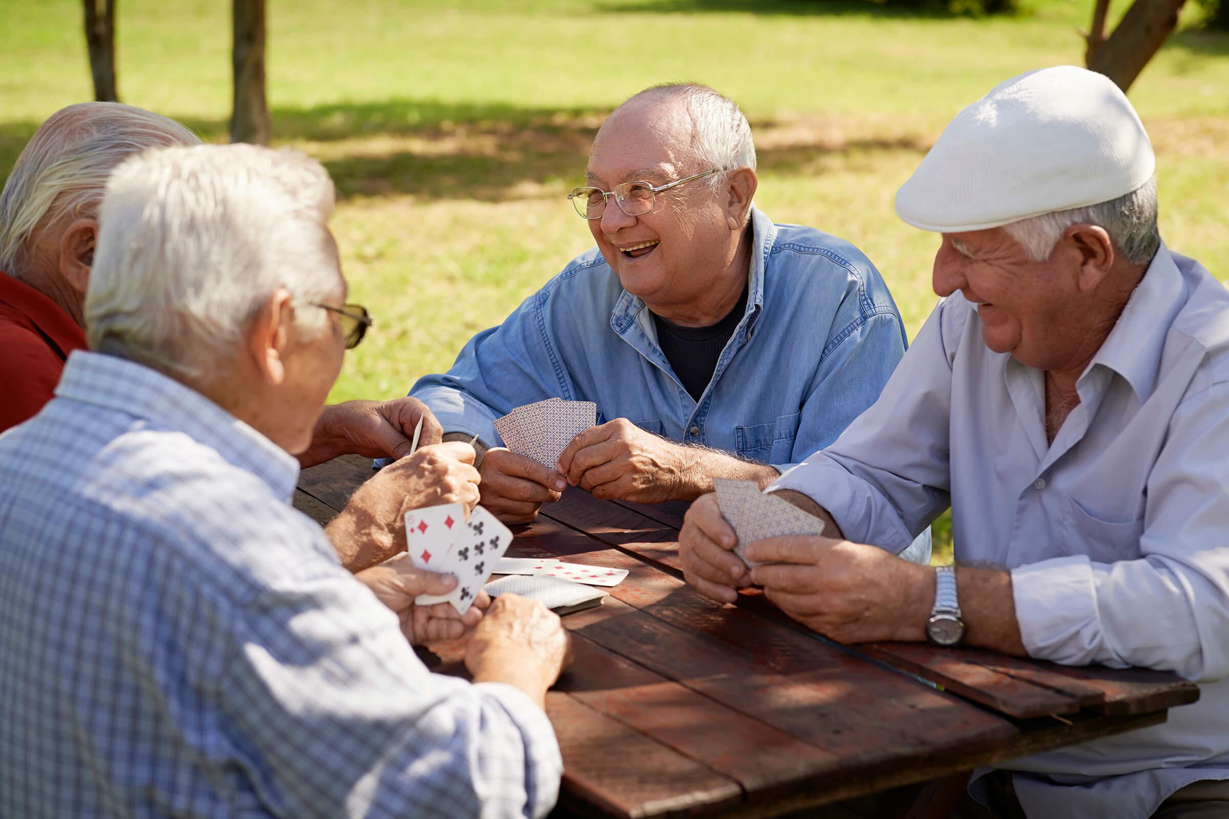 a group of people sitting at a picnic table