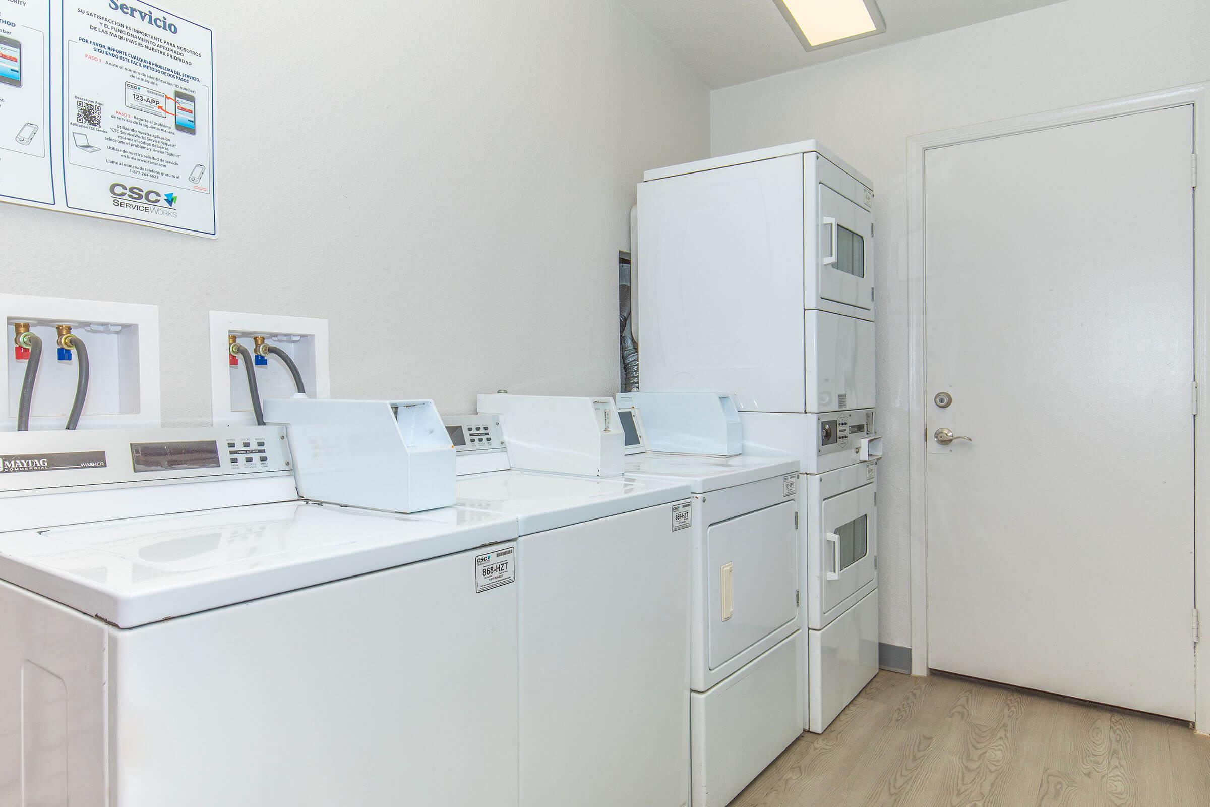 a kitchen with a sink and a refrigerator