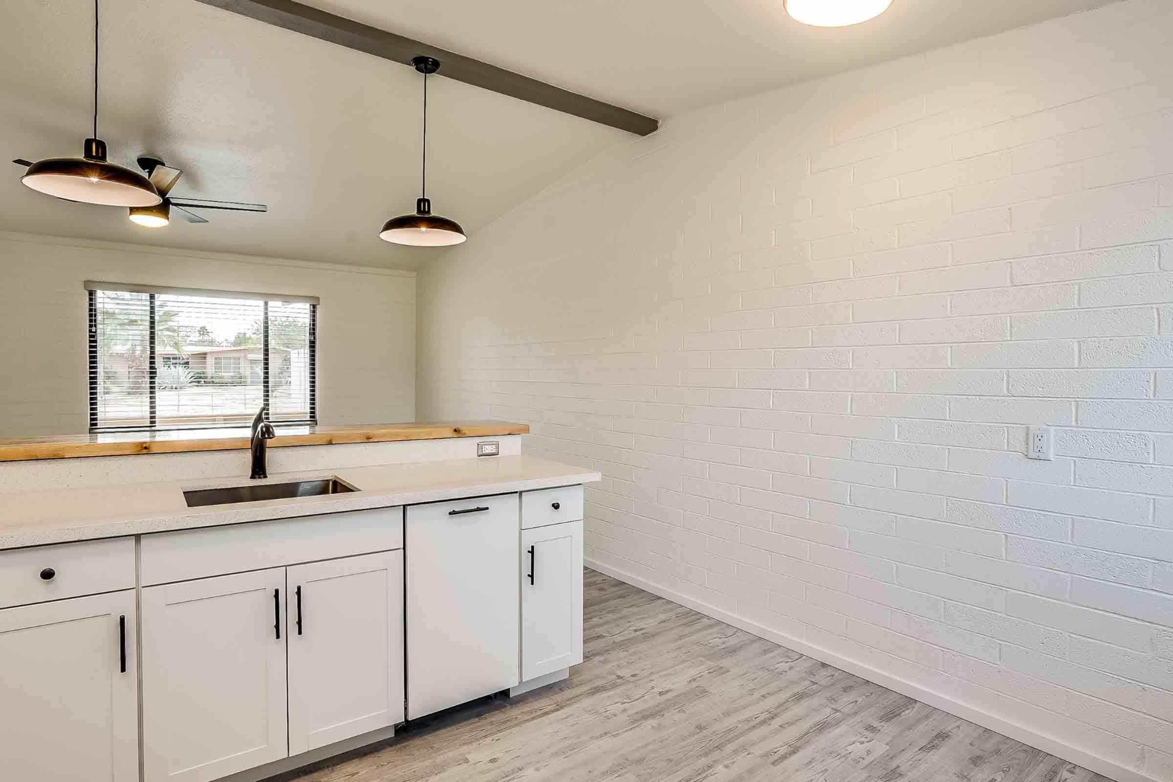 a kitchen with a stove and a sink