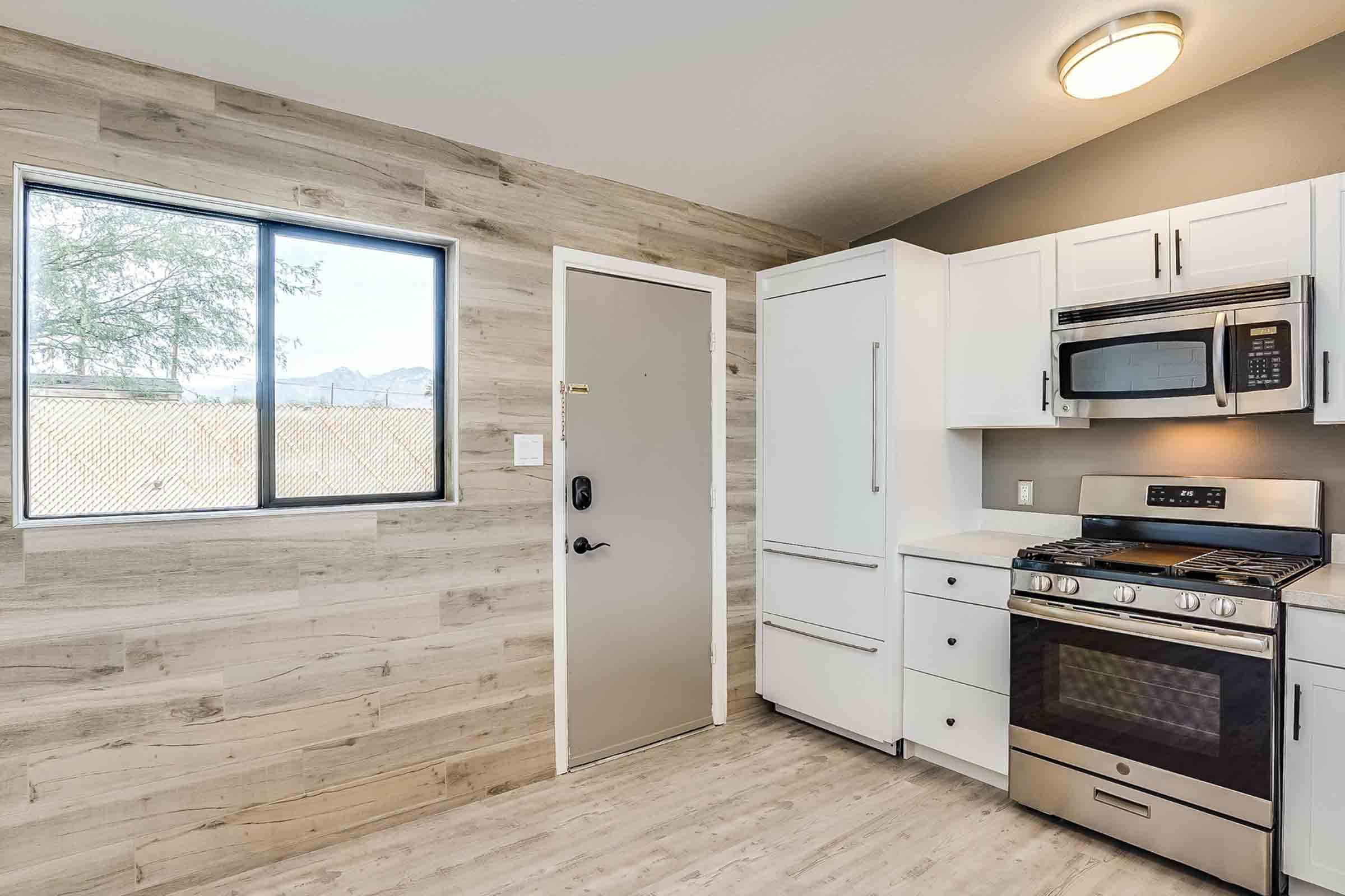 a kitchen with a large window