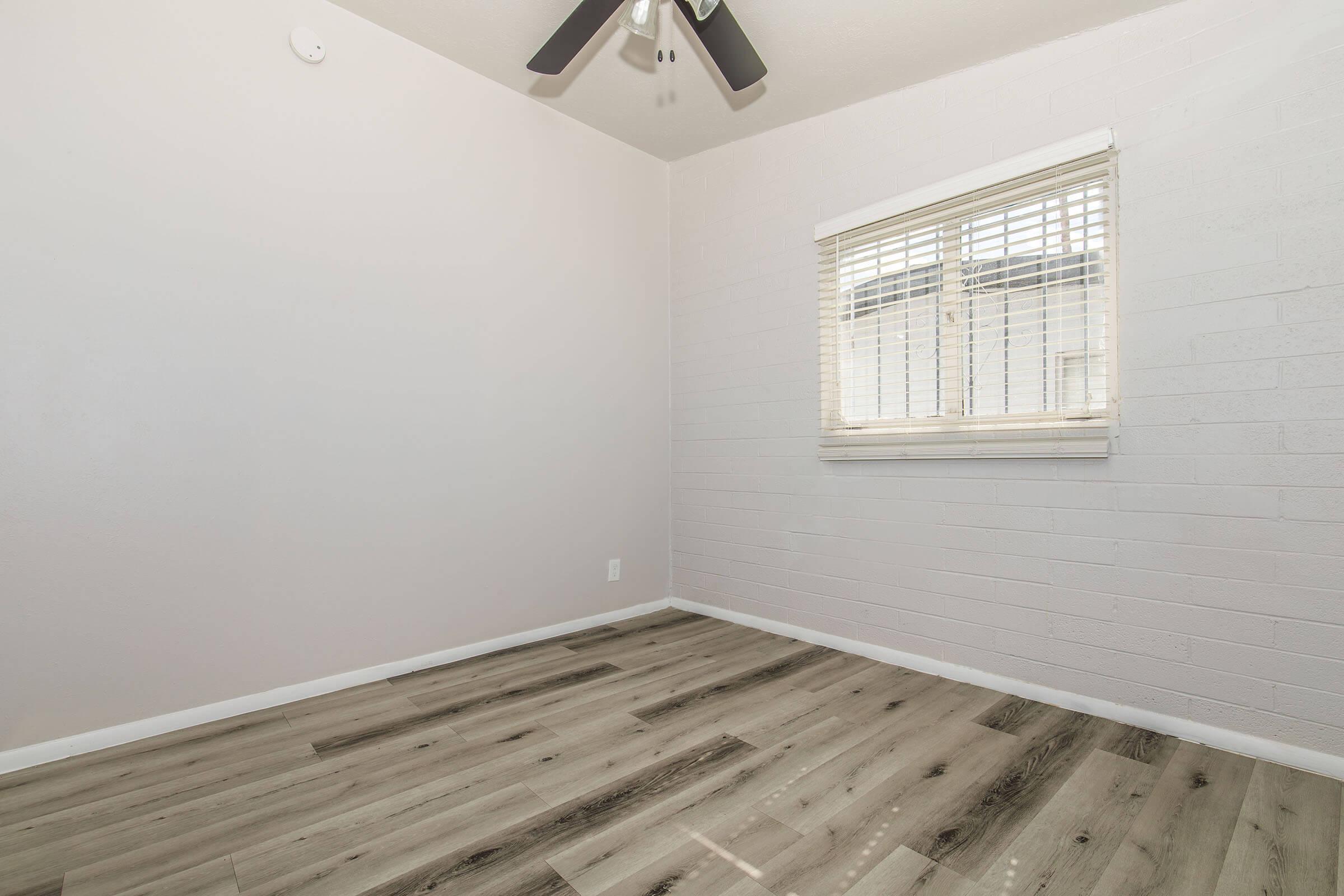 a bedroom with a large window