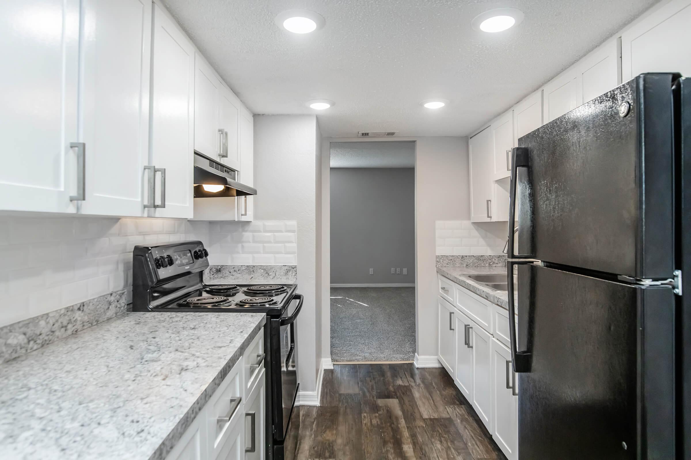 a large kitchen with stainless steel appliances