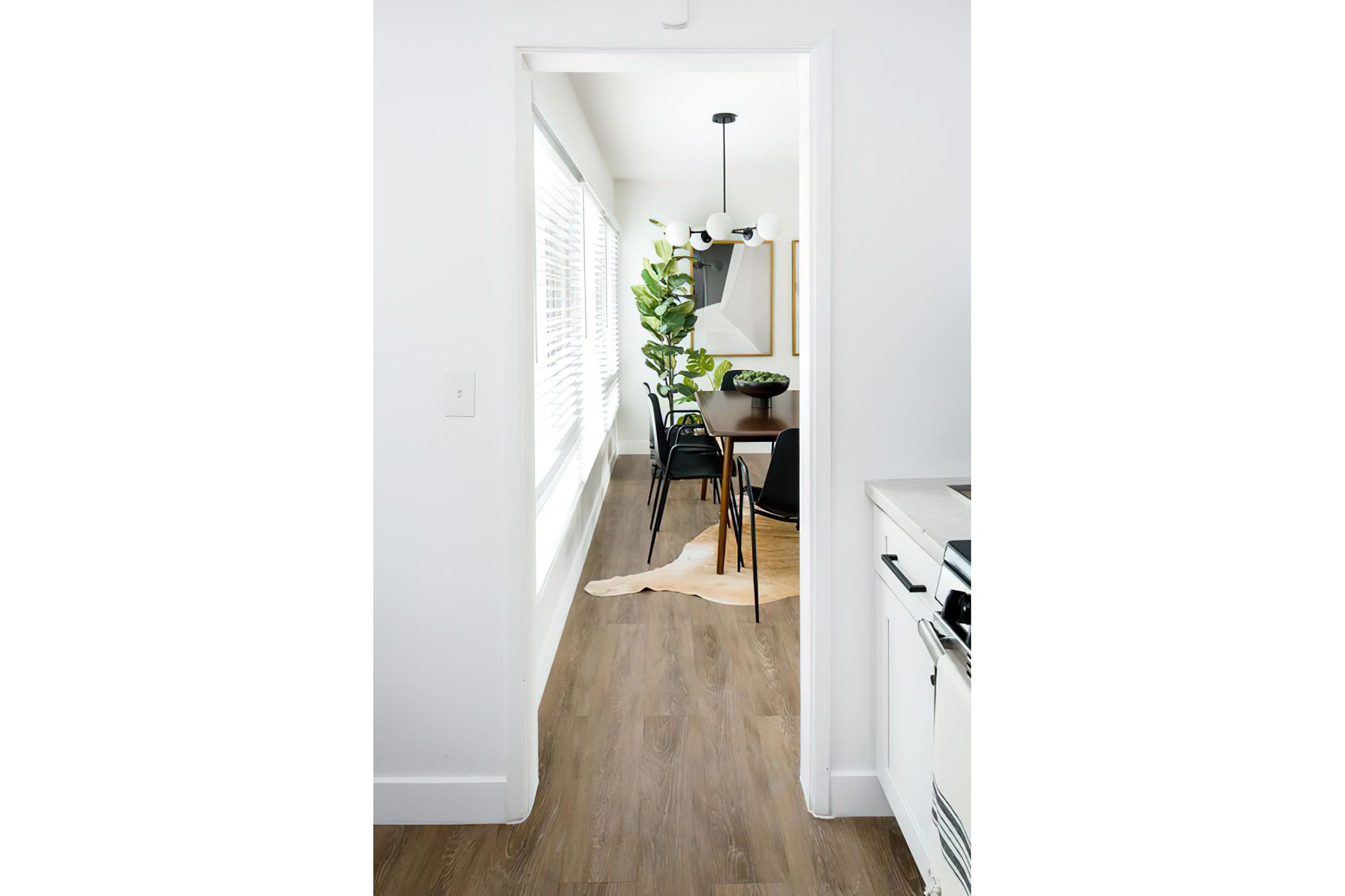 Dining room view with big window and blinds